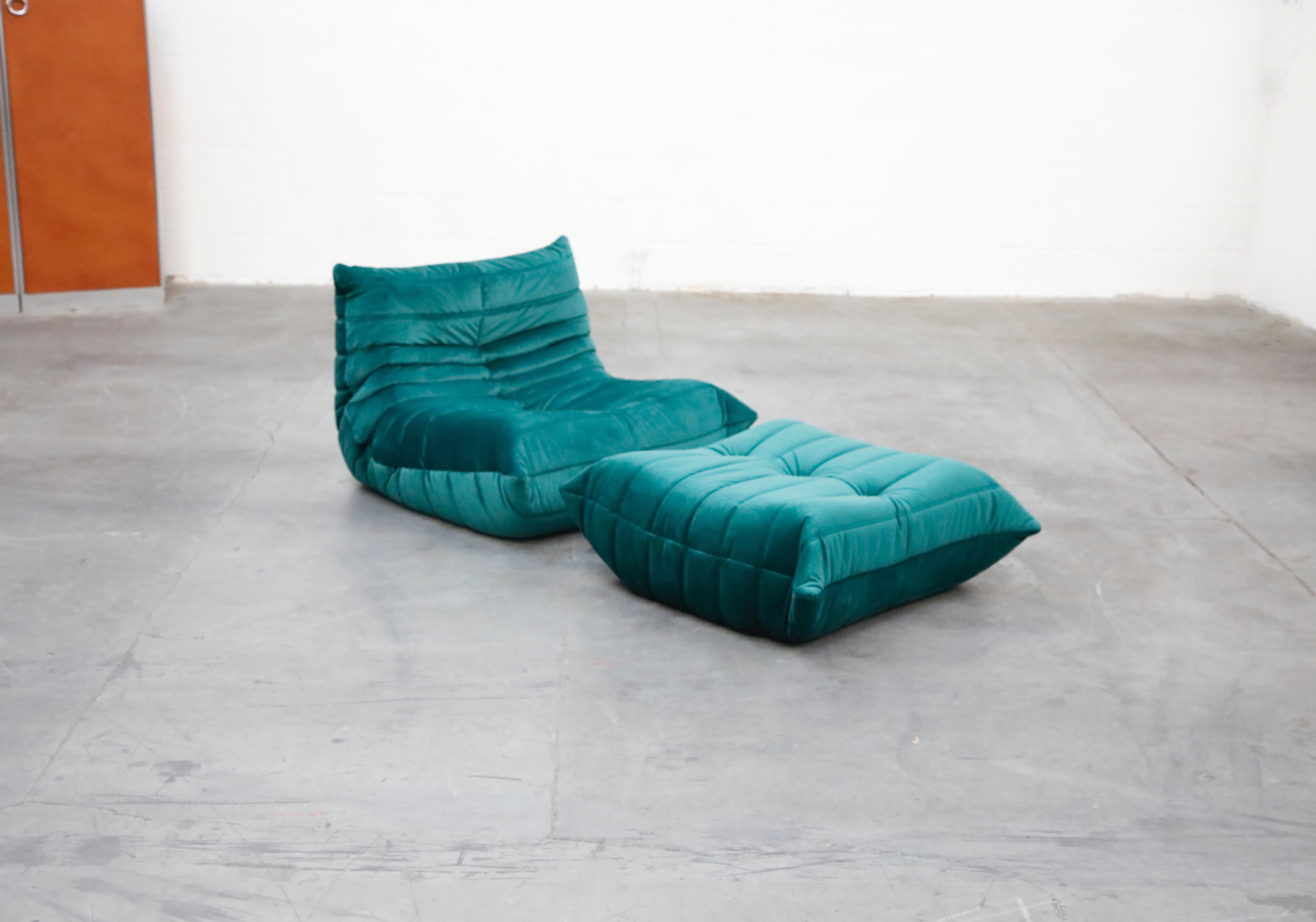 This incredible 'Togo' fireside lounge chair and ottoman was designed by Michel Ducaroy in 1973 for Ligne Roset, France. This Togo set was completely restored with new high grade velvet upholstery in a mesmerizing Emerald Green color, and bottom
