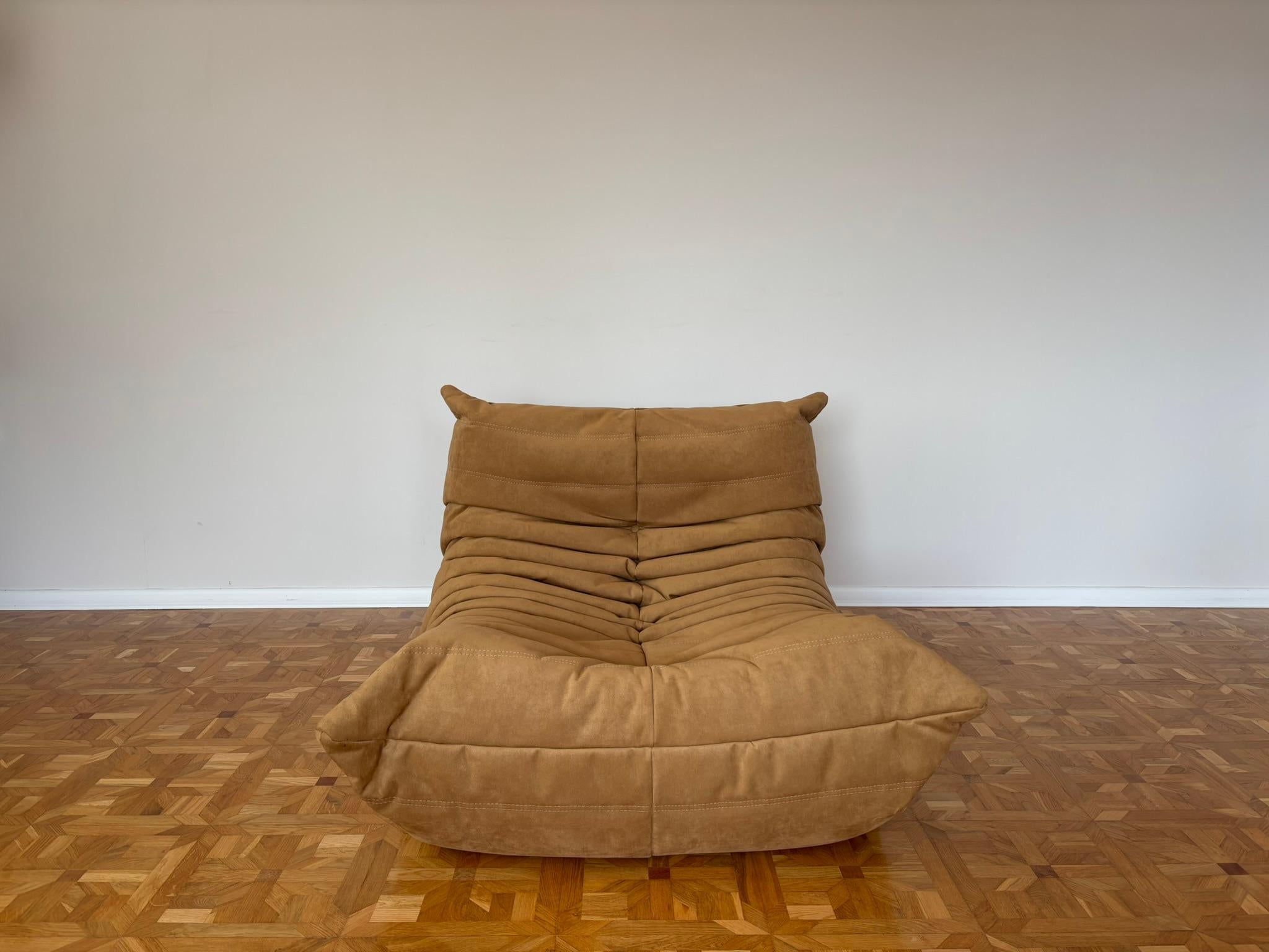 The Togo was designed by Michel Ducaroy in 1973 for Ligne Roset. It is the first sofa/chair ever made only of foam and leather. The collection features an ergonomic design with polyether foam construction and padded covers, making each piece both