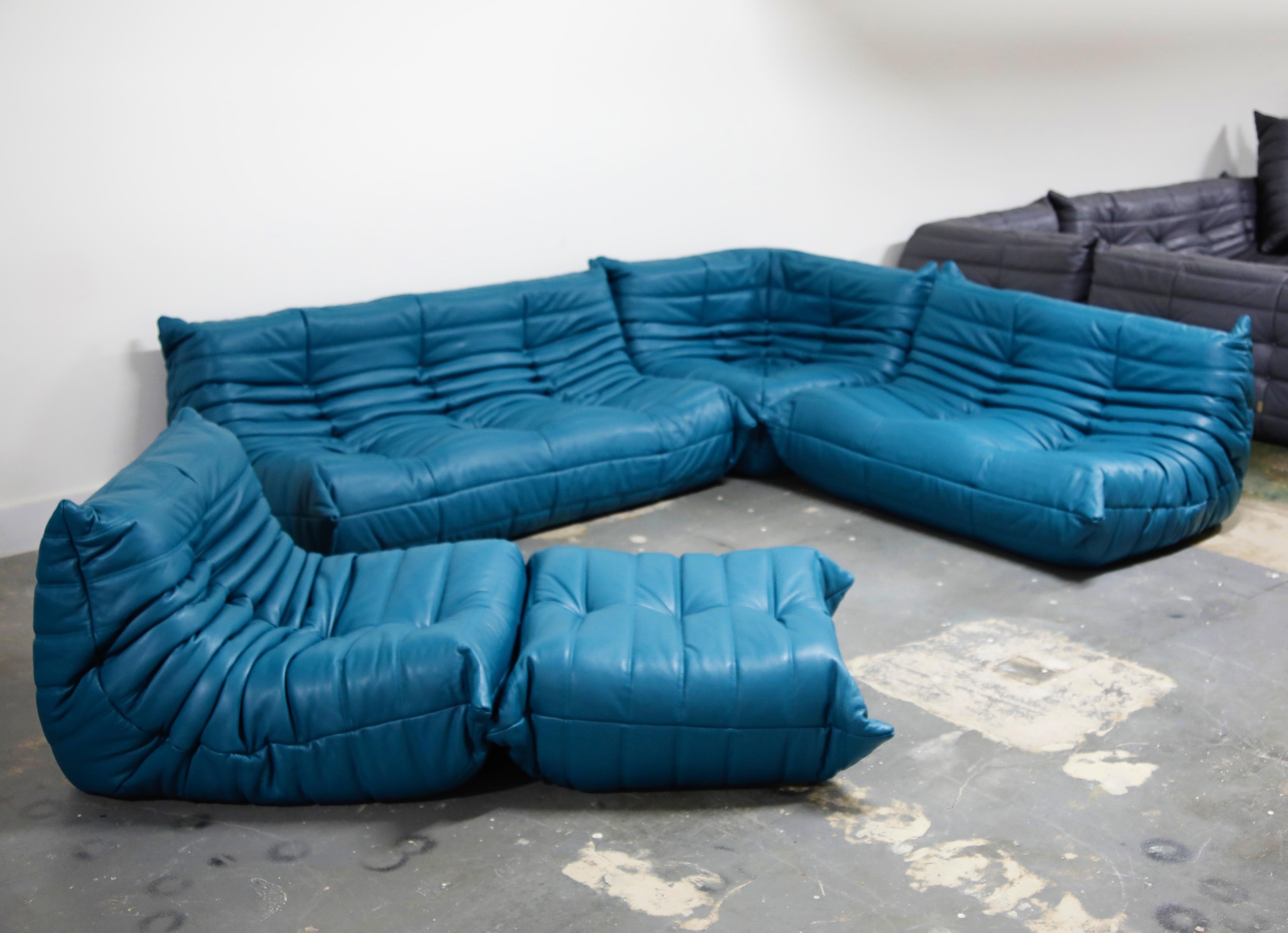 This incredible five (5) piece Togo sectional living room set, was designed by Michel Ducaroy in 1973 for Ligne Roset, France. This set was completely restored with new high grade Bovine leather upholstery in a mesmerizing Petrol Blue color, and