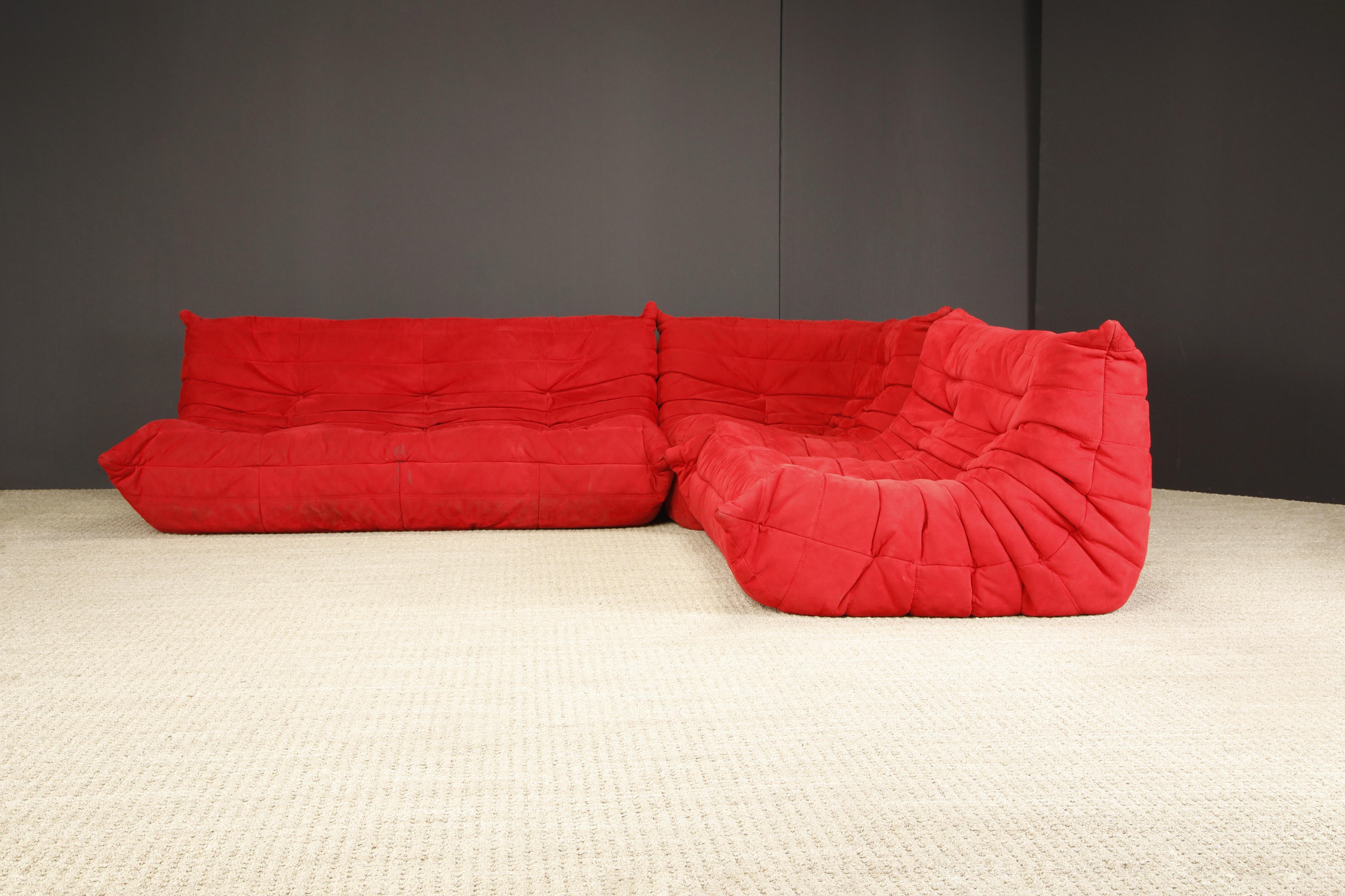 This designer on-trend 'Togo' sectional living room set, was designed by Michel Ducaroy in 1973 for Ligne Roset, France. Signed with Ligne Roset labels on each piece. This set comprised of a three-seat sofa, two-seat loveseat and a corner seat.