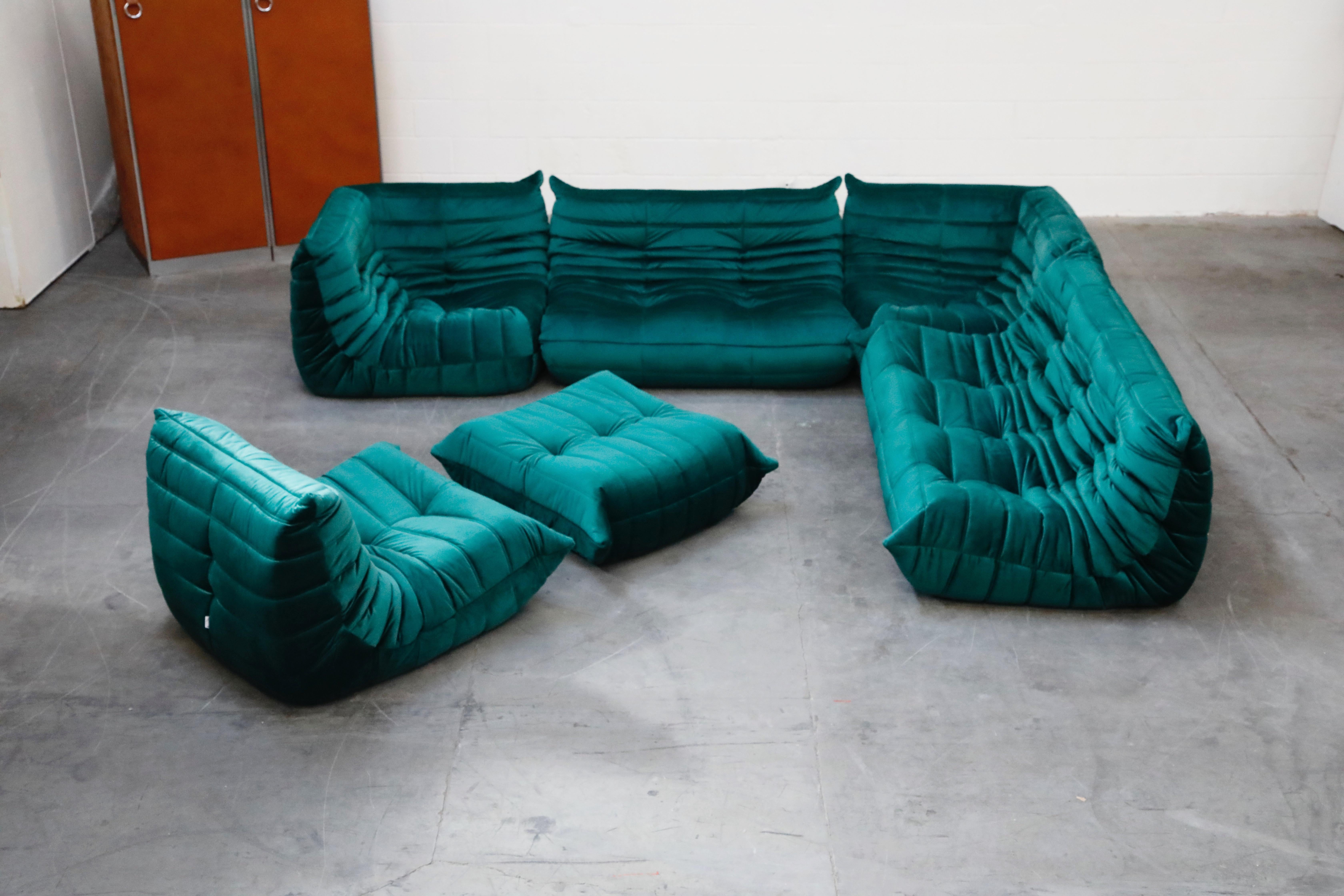 This incredible six (6) piece Togo sectional living room set, was designed by Michel Ducaroy in 1973 for Ligne Roset, France. This set was completely restored with new high grade velvet upholstery in a mesmerizing emerald green color, and bottom