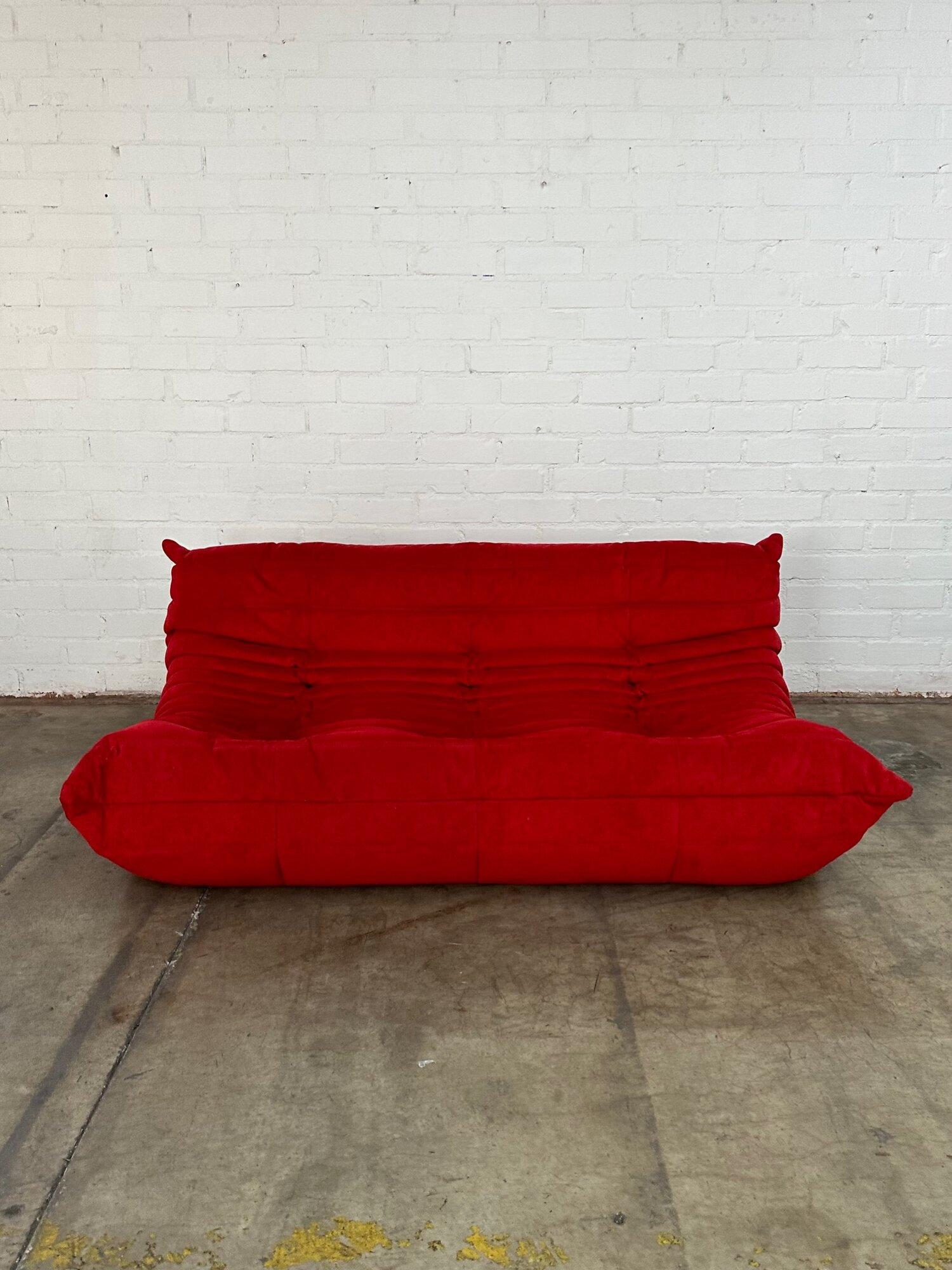 W66 D39 H28 SW65 SD22 SH15

Authentic Ligne Roset Togo sofa in Goya Red Alcantra. Item is in great condition used only for staging. Fabric is clean with no rips or tears. 

