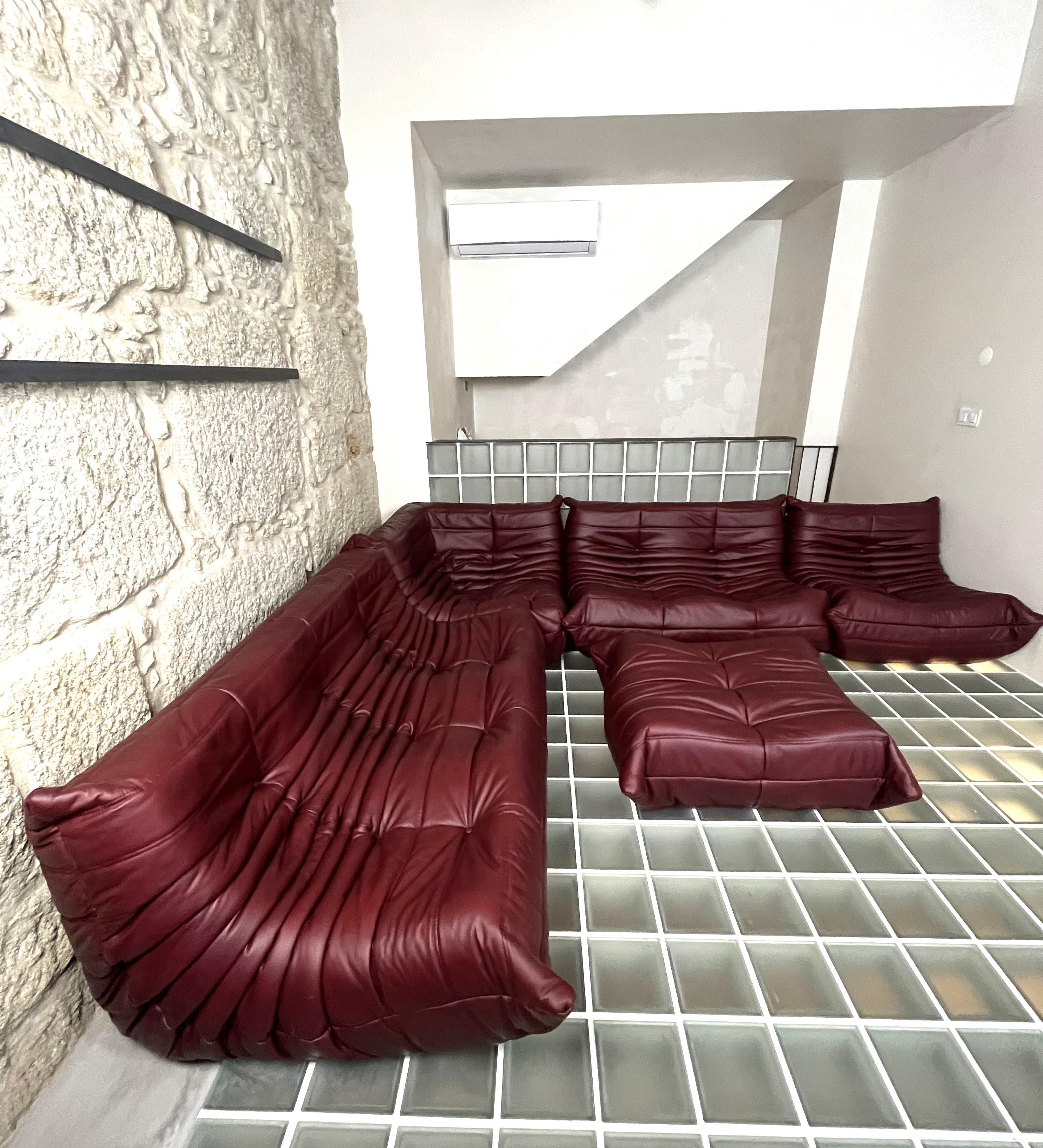 Togo sofa by Michel Ducaroy for Ligne Roset. 5 pieces set
Togo was designed in 1973.
Five pieces set: three seater, twoseater, one seater, corner and pouf.
The sofa is upholstered in bordeaux leather.
the set is very versatile, five pieces can be