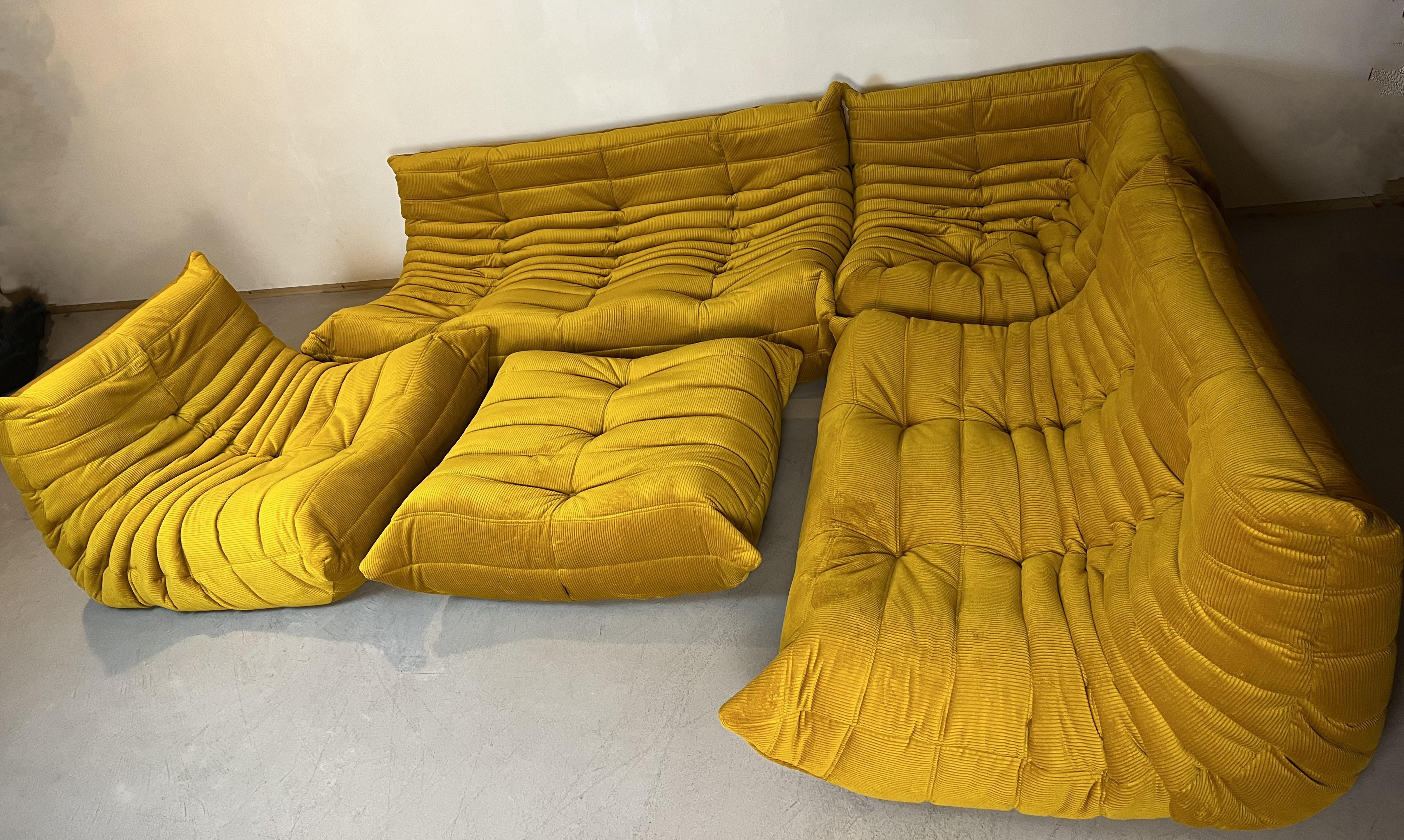 Togo sofa by Michel Ducaroy for Ligne Roset. 5 pieces set
Togo was designed in 1973.
Five pieces set: three seater, twoseater, one seater, corner and pouf.
The sofa is upholstered with yellow fabric.
the set is very versatile, hte pieces can be