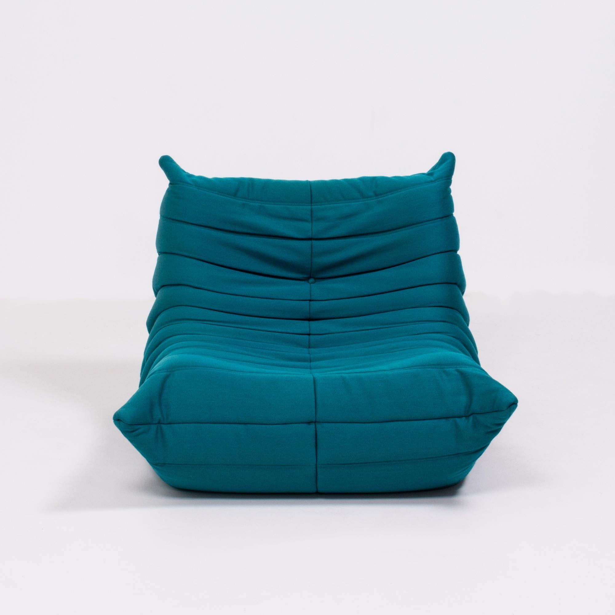 teal armchair and footstool