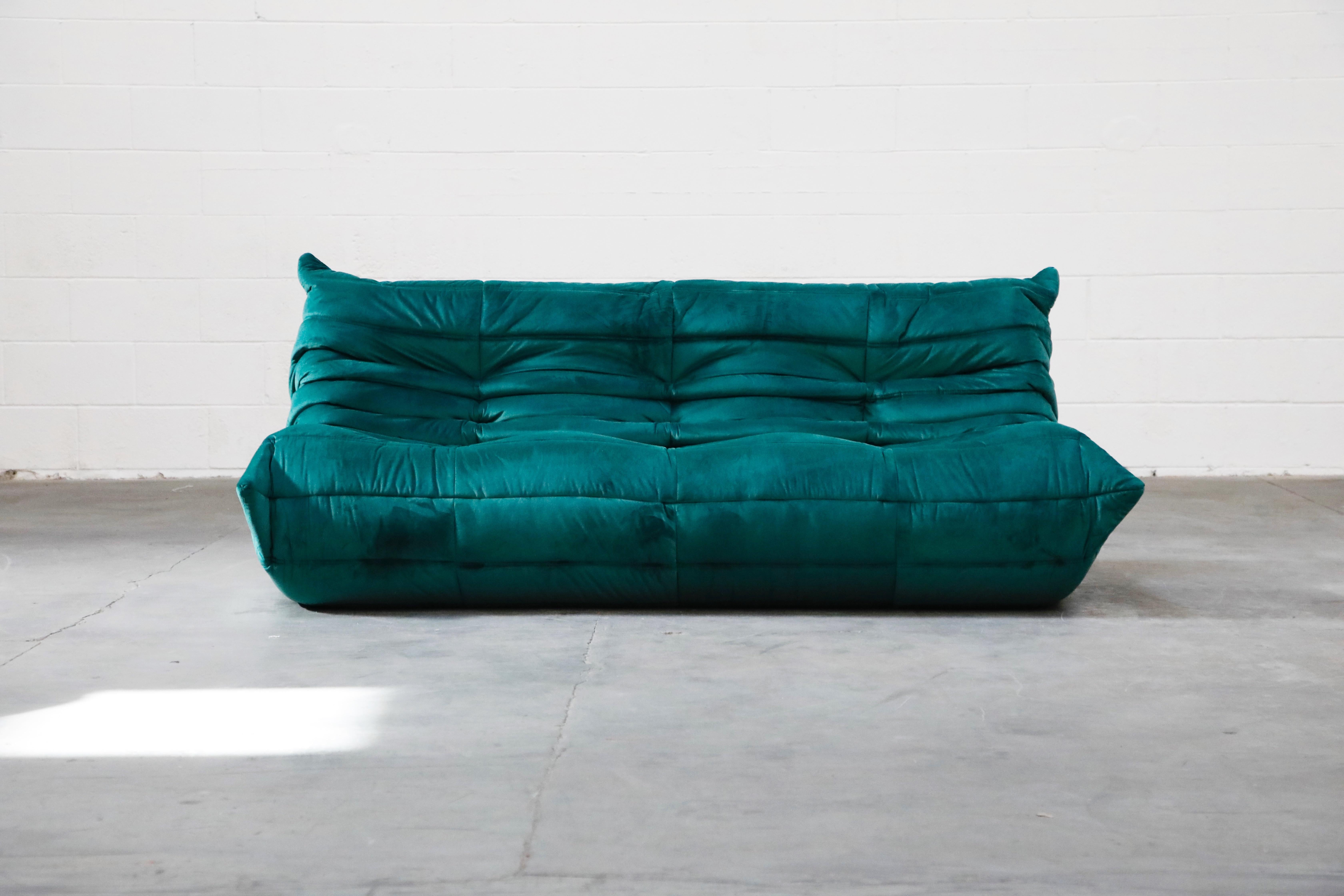 This incredible 'Togo' three-seat sofa was designed by Michel Ducaroy in 1973 for Ligne Roset, France. This Togo sofa was completely restored with new high grade velvet upholstery in a mesmerizing Emerald Green color, and bottom decking fabric has