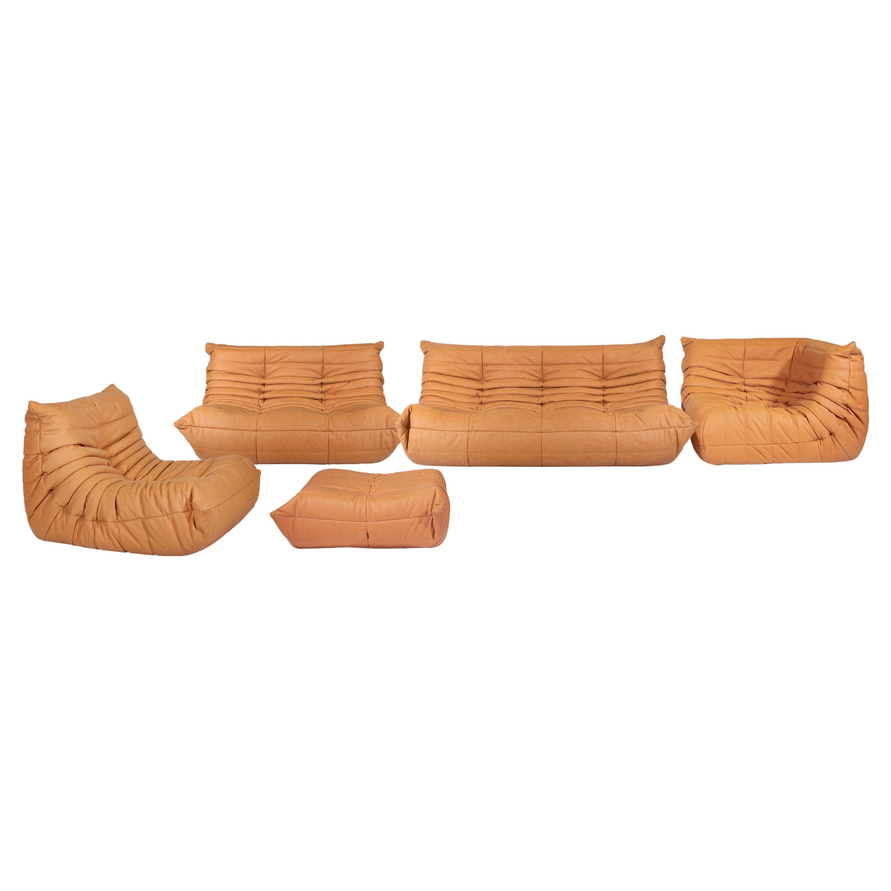 Togo sofa set is a 1990s design sofa set designed by Michel Ducaroy for Ligne Roset.

A Ligne Roset classic, Michel Ducaroy's Togo has been the ultimate in comfort and style for over forty years.

The set consist in four cognac leather all-foam