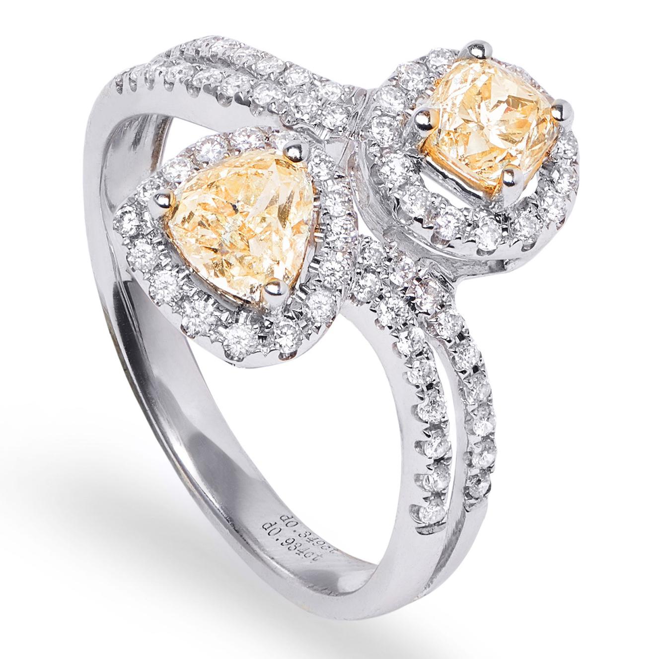 The 'Toi et Moi' Fancy Yellow Diamond Ring is a classic  re-imagined in 18k White Gold with 18k Yellow Gold and 65 White Diamonds accents around two beautiful Canary Diamond centre-stones. 
Also makes a very modern and unique engagement ring.

Ring