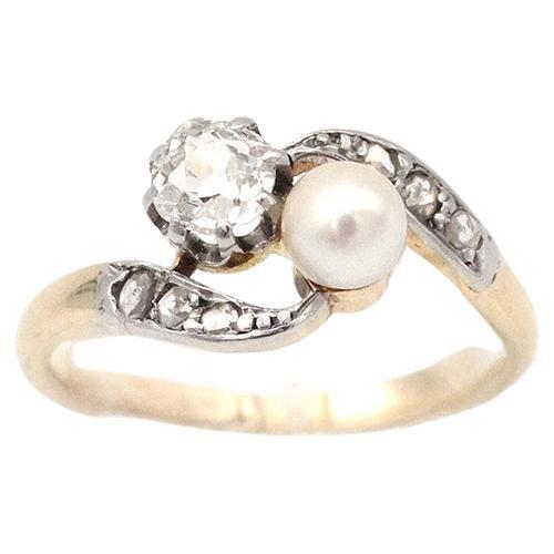 Toi et moi French Edwardian diamond and pearl ring in 18k gold and platinum