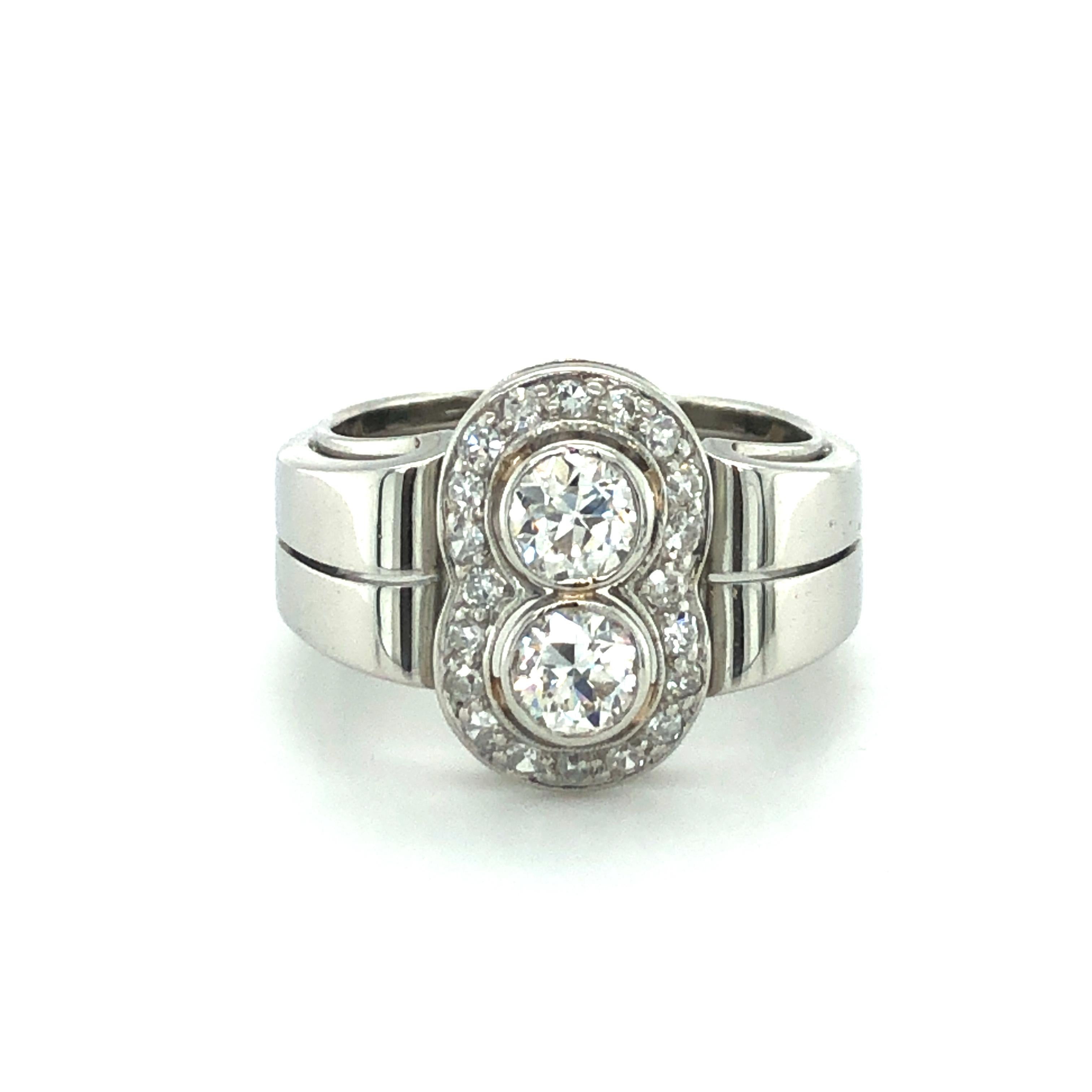 This charming Toi et Moi ring is set with two beautiful Old European Cut diamonds of H/I colour and vs/si clarity, total weight approximately 0.70 carats. The entourage is set with 20 old single-cut diamonds of H/I colour and si/i clarity, total