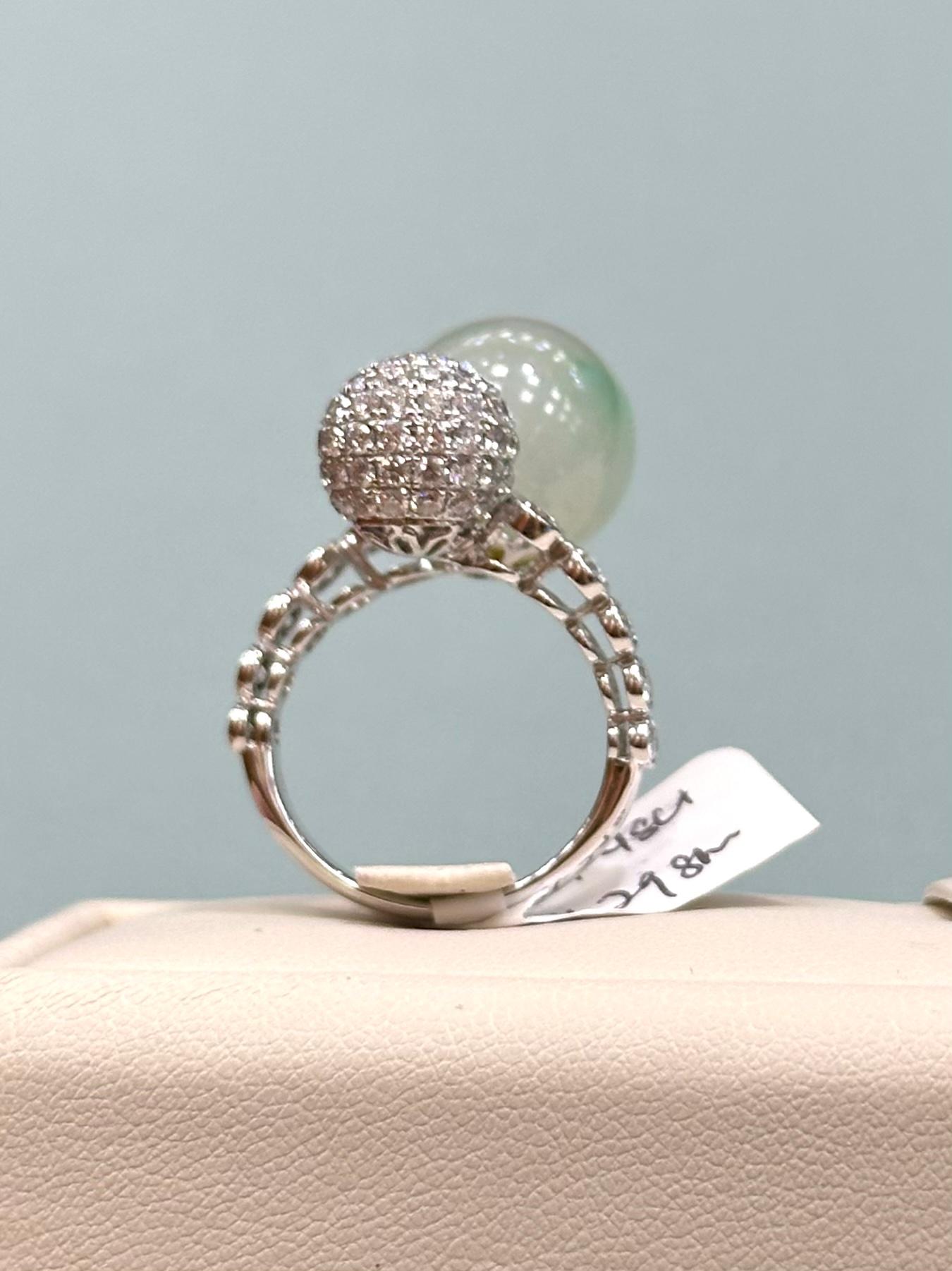 Toi et Moi Spherical Jade and Diamond Ring in 18k White Gold with over 1.48 cts of diamonds. 

A total weight of 11.298 grams.