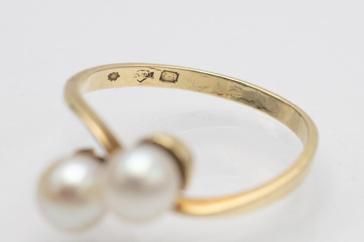 Vintage ring made of 14-karat yellow gold (0.585 fineness).

Origin: Western Europe, late 20th century.

Toi et Moi (you and me) ring, decorated with 2 cultured pearls, diameter 5.85-5.95mm

Size: 18 (EU 58) - ask about the possibility of size