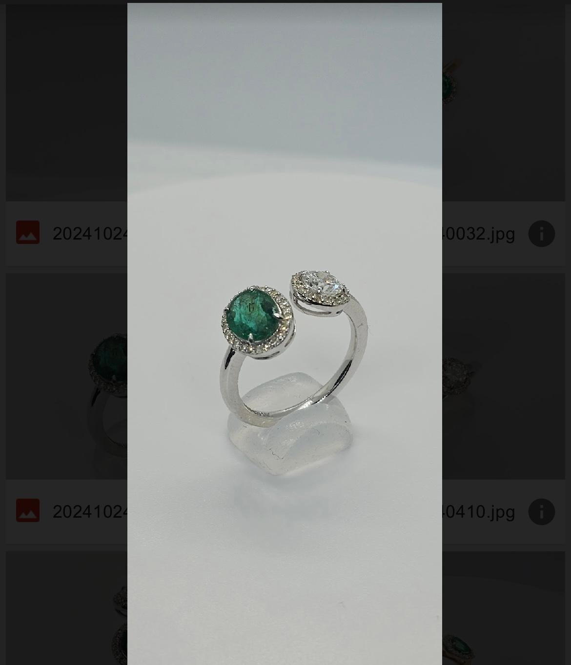 Total Weight: 3.21 grams 
Center Stones: 1.32 carat Zambian Emerald
0.83 (0.61 centre) carat Natural Diamond HI SI1-2

Presenting an extraordinary Toi et Moi ring—a masterpiece that embodies the romance of two worlds entwined in perfect harmony. At