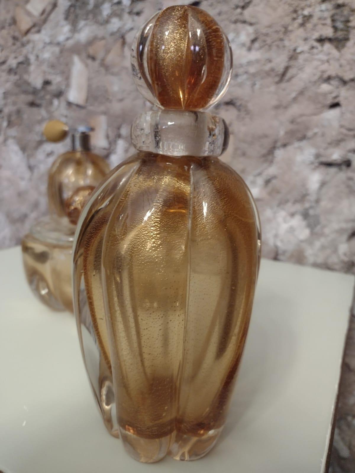 Set in  blown Murano glass, amber with gold inclusion.
Attr to E. Barovier.
Murano, 1930s 
