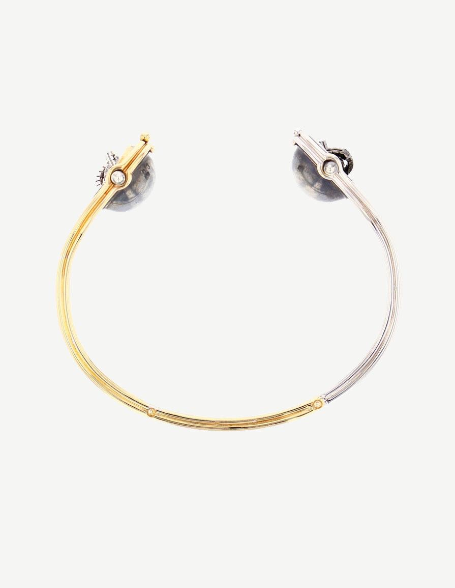 Diamonds Toi&Moi Bracelet set with Pearls in 18k yellow gold by Elie Top. Toi&Moi bangle made from 18K yellow gold and distressed silver. Includes two pivoting spheres opening onto an Akoya Pearl and a Tahitian Pearl, set respectively with a White