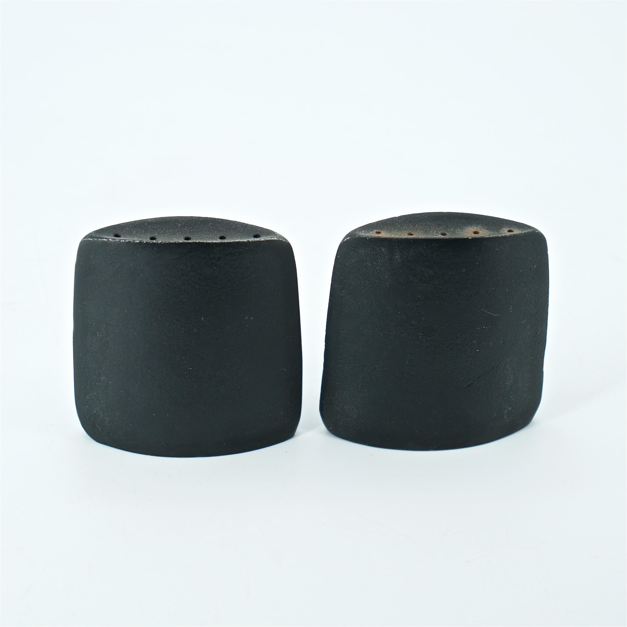 Cast metal salt and pepper shakers, will provide cork stoppers. Designer unknown. Ink stamped, Tokaido.
 