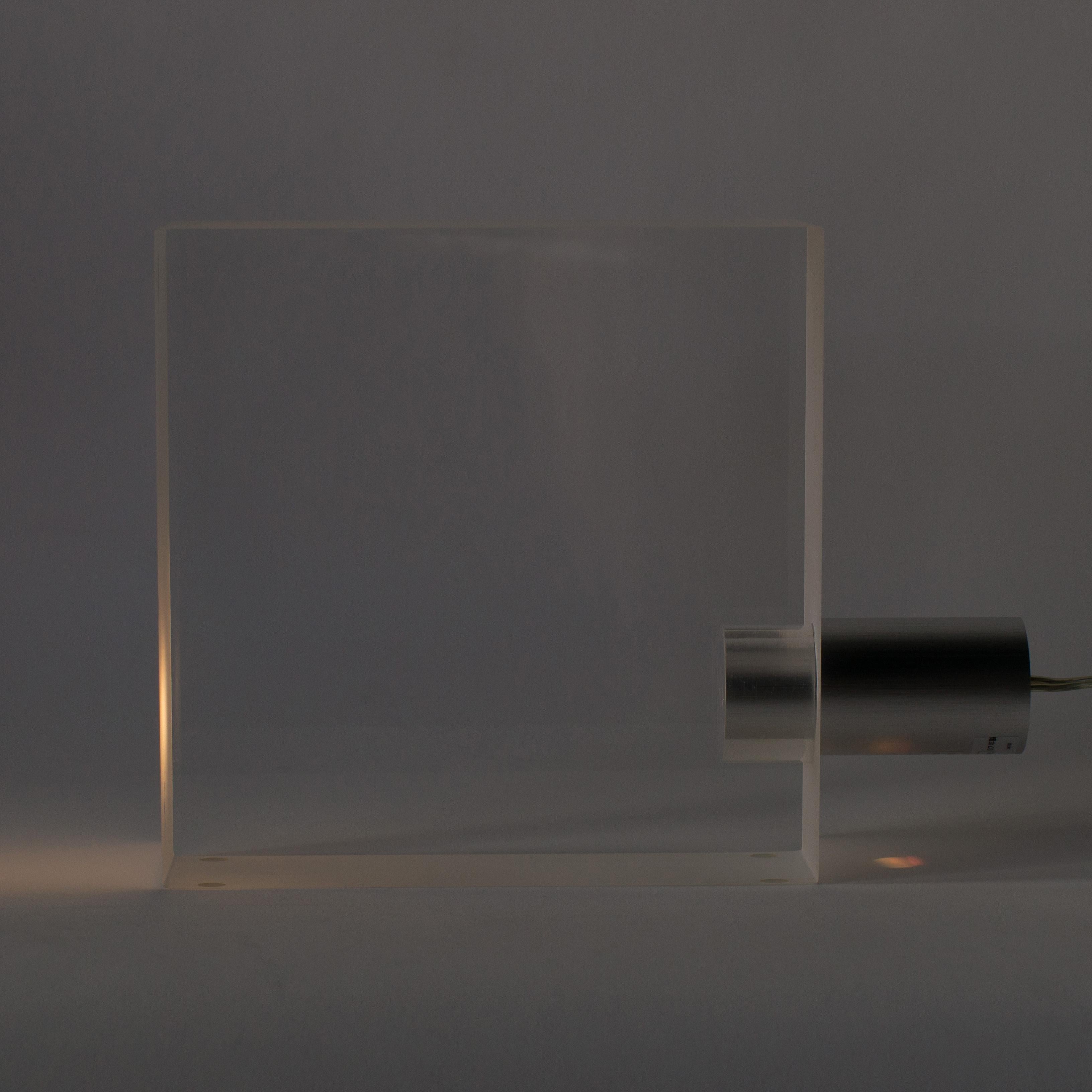 Tokujin Yoshioka's Tofu acrylic lamp. Acrylic cube reflect light beam and make fantastic atmosphere.
Working with 100-120V.