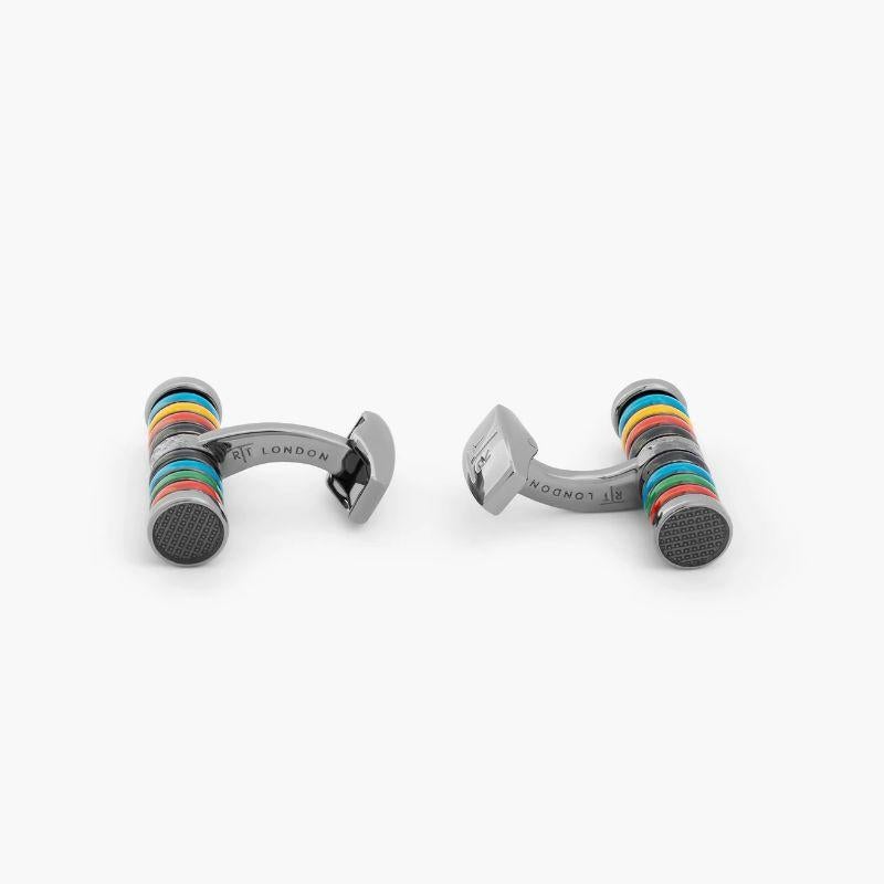 Tokyo Rings Cylinder cufflinks with multicolour enamel and palladium finish

These sports inspired cufflinks feature a series of coloured rings wrapped around a a rhodium or gunmetal plated base metal cylinder cufflink. Each of the individual rings