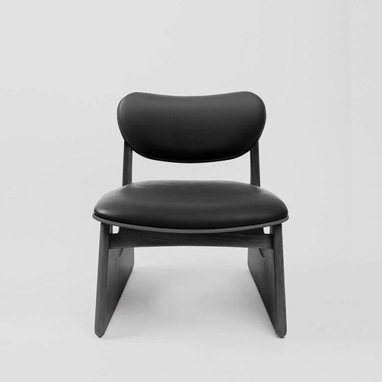The Tol easy chair, designed by Unicuo for the Masa Collection, is inspired by the Mên-an-Tol, an ancient stone monument known for its circular opening. Referencing its symbolic form, the chair features clean, sculptural lines that blend simplicity