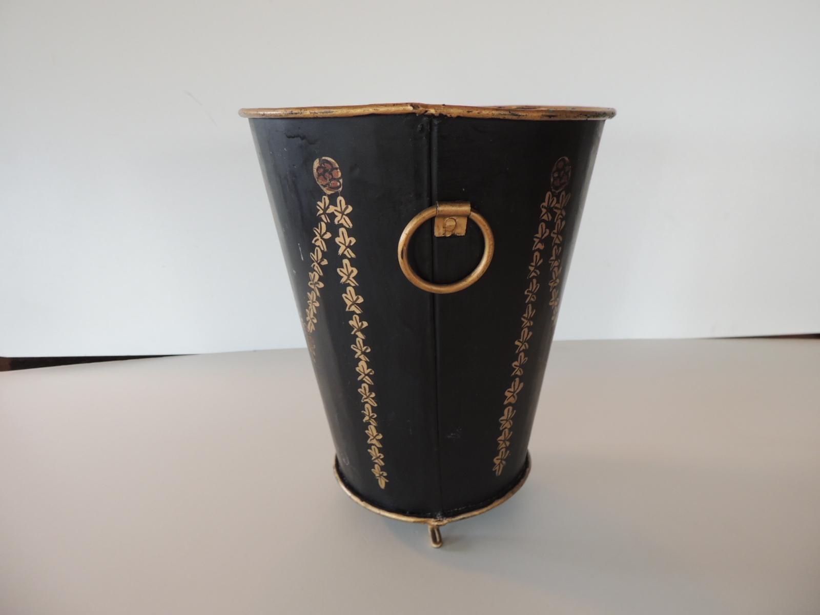 Tole black and gold catchpot depicting garlands and bows.
Small gold leaf feet.
Size: 7.5