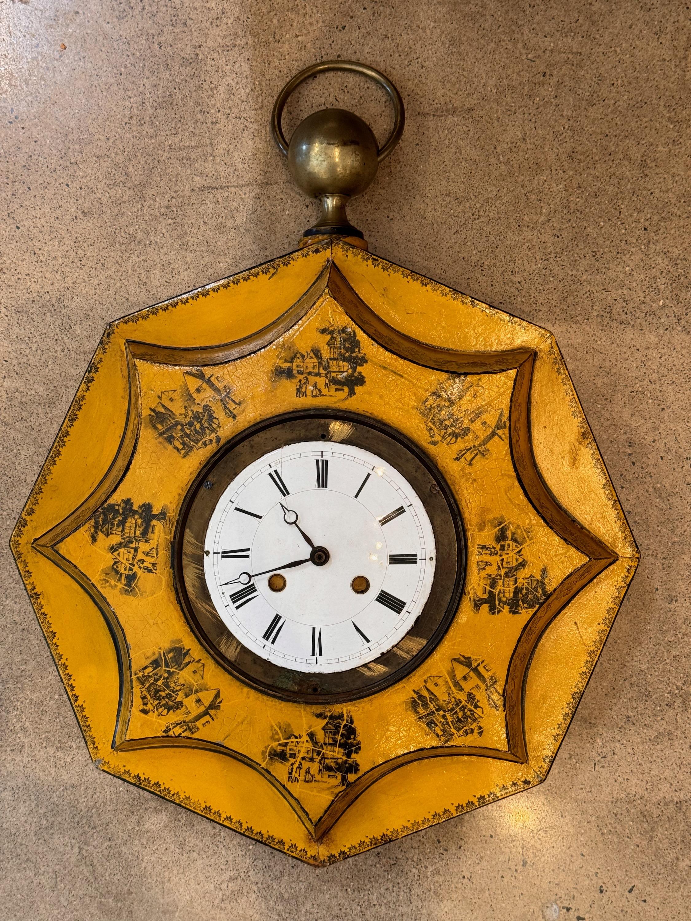 A decorative tole clock. It is non working. Made in the 19th Century