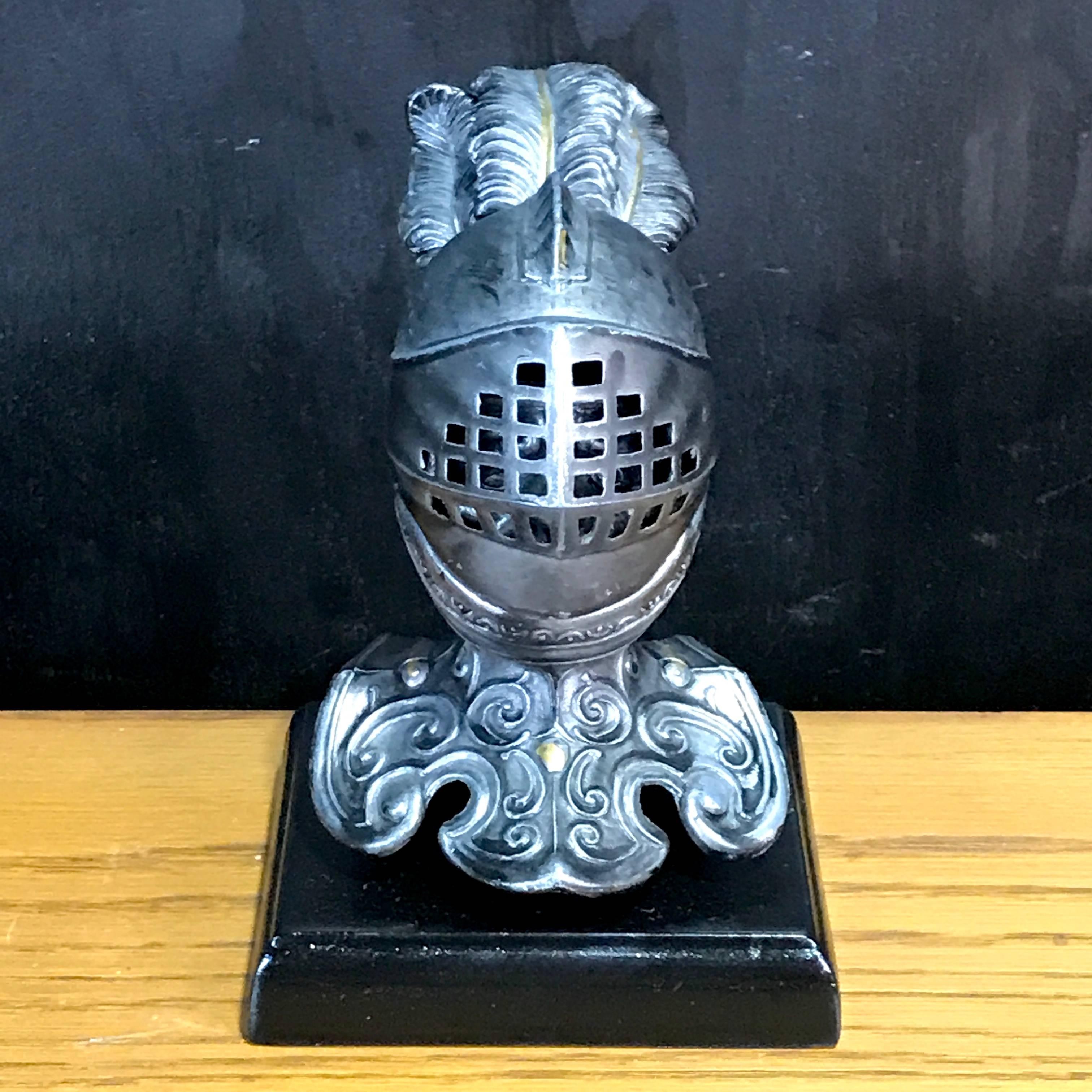 Tole Figural Knight Inkwell

Add a touch of classical whimsy to your home or office with our tole figural knight inkwell. Made in early 20th century England, this charming piece is adorned with an expressive knight complete with a lift top visor. It