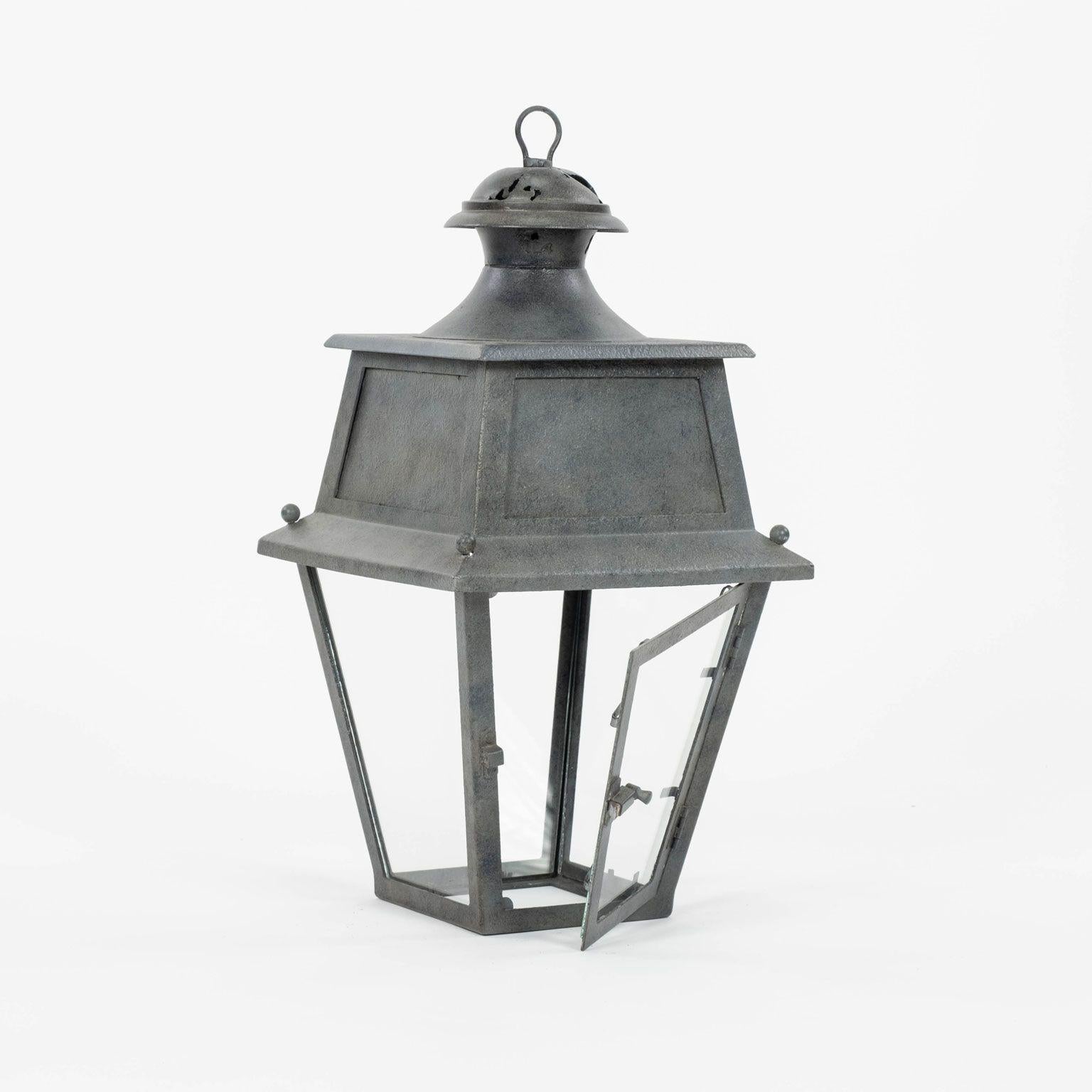 Tole, glass and iron lantern dating to early 20th century, France. Not wired for electricity, but can be wired, or fitted for usage with gas, for an additional cost. Includes chain and a canopy (listed height does not include chain). Restored finish