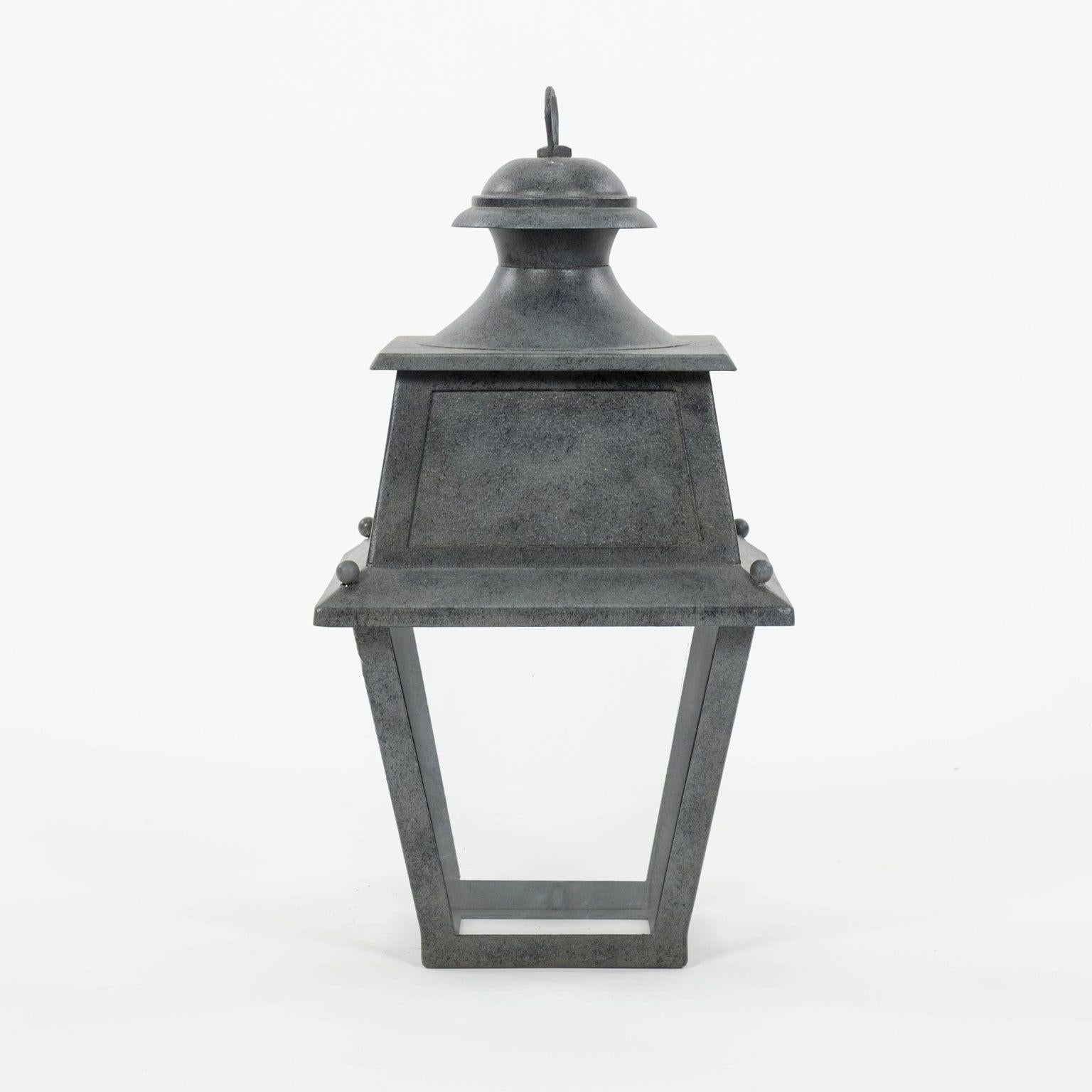 Tole, glass and iron lantern dating to early 20th century, France. Not wired for electricity, but can be wired, or fitted for usage with gas, for an additional cost. Includes chain and a canopy (listed height does not include chain). Restored finish