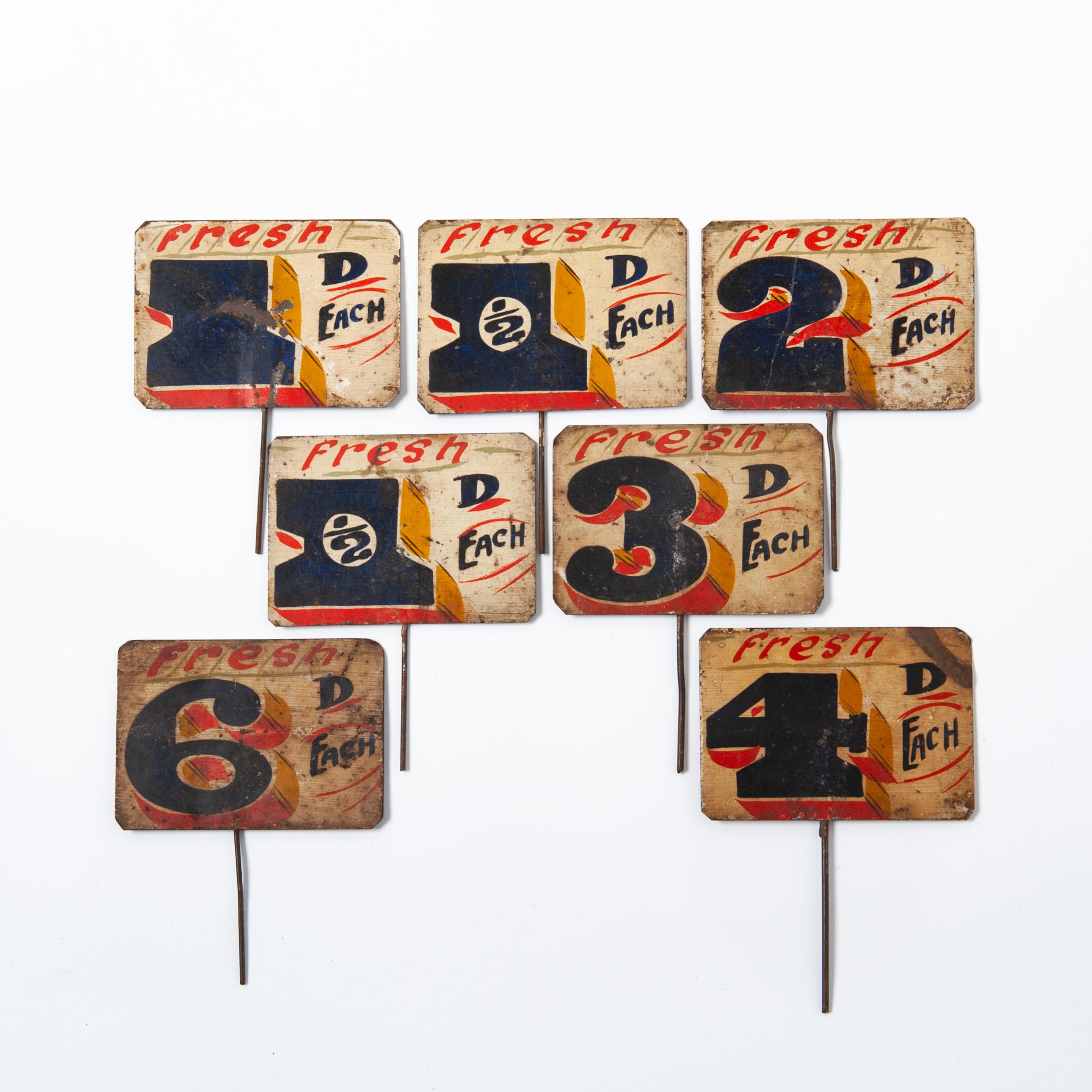 7 Tole Painted Grocers Signs.
England, circa 1900.
Overall height including pins 15cm.