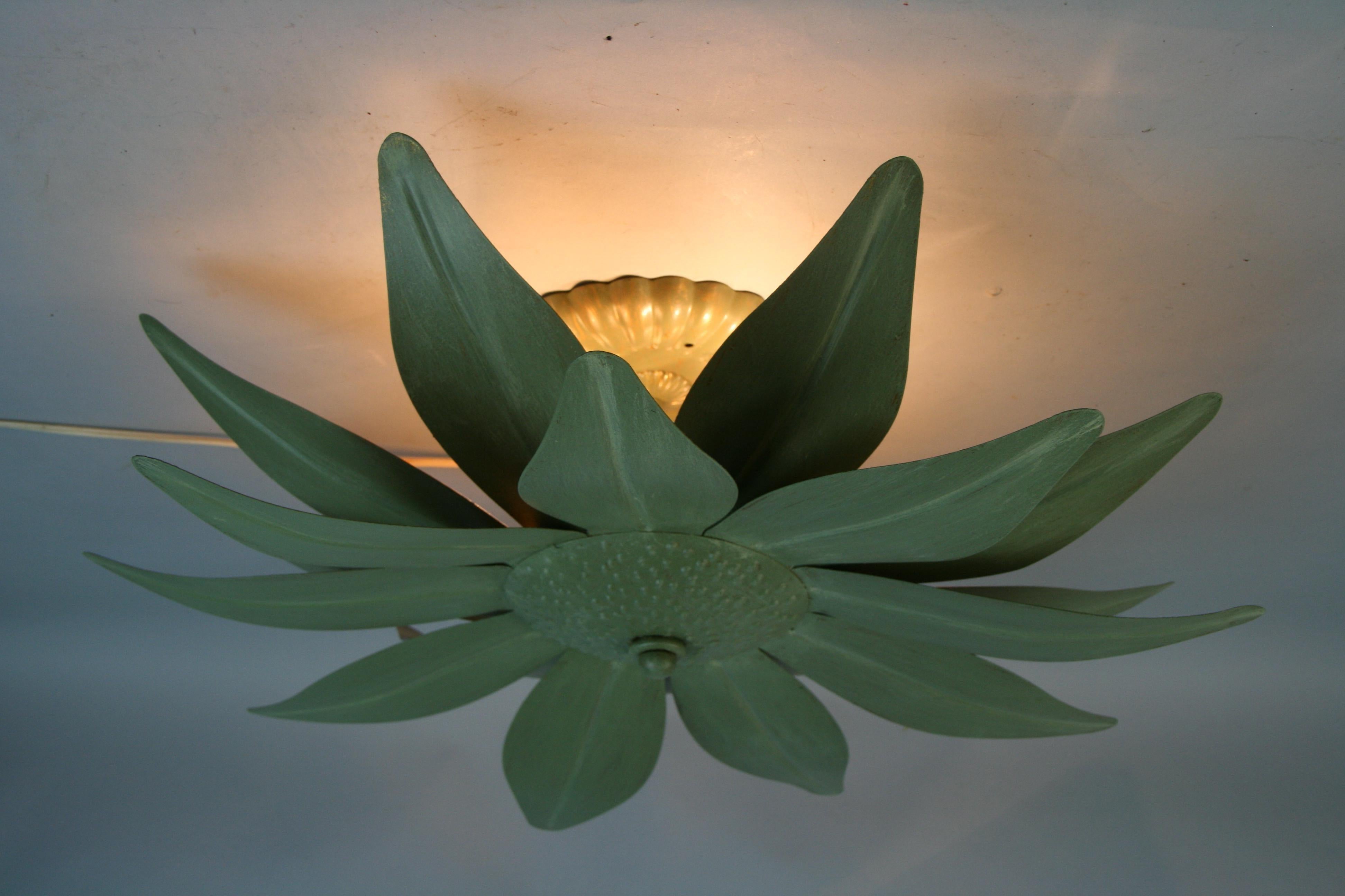 1410 Tole green leave 3 light flush mount.
Back of leaves in gold to reflect the light on cieling.