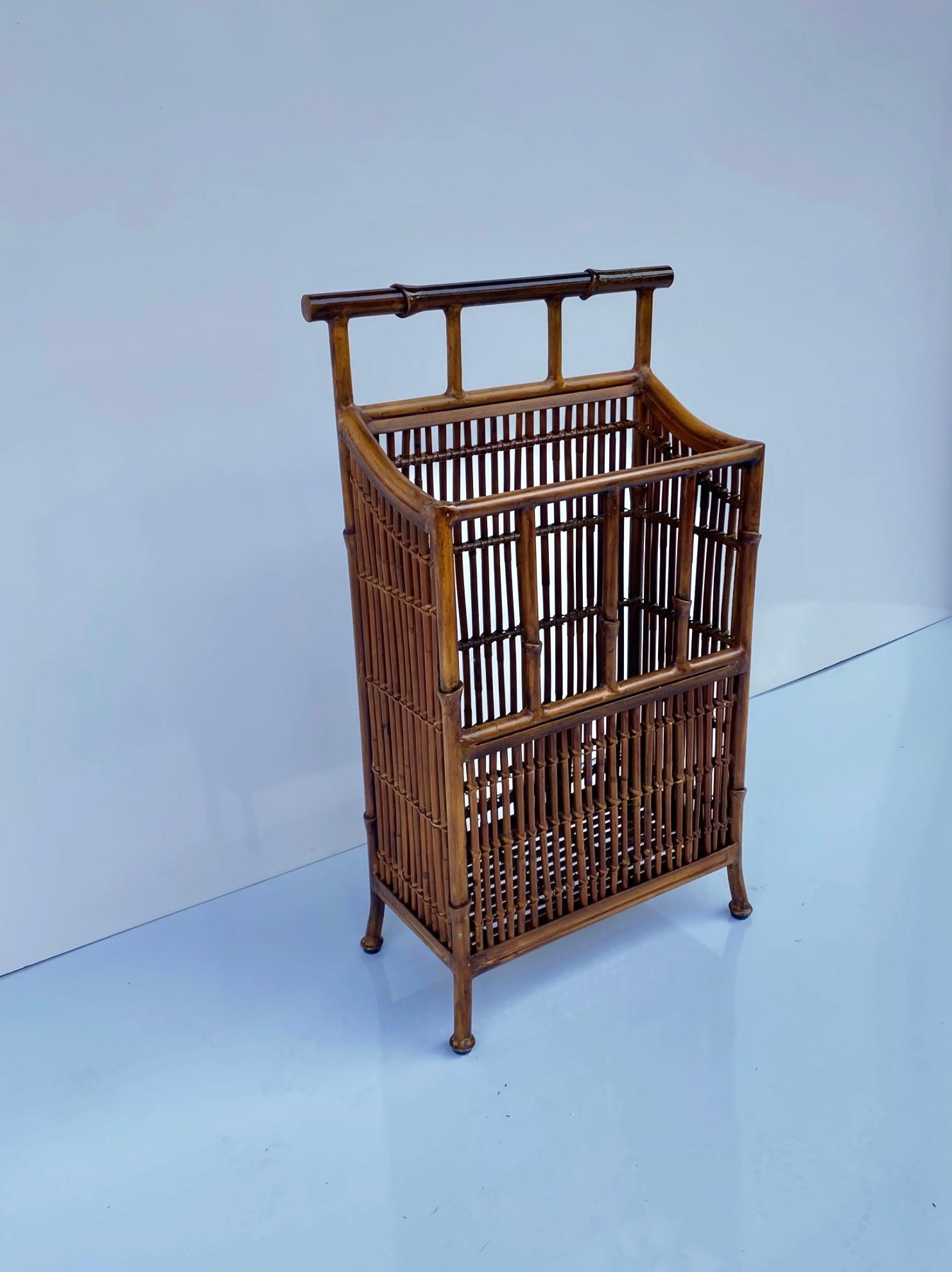 This is a fun regency style faux bamboo tole metal magazine rack or umbrella stand. It is in very good condition and is attributed to Maitland -Smith. 