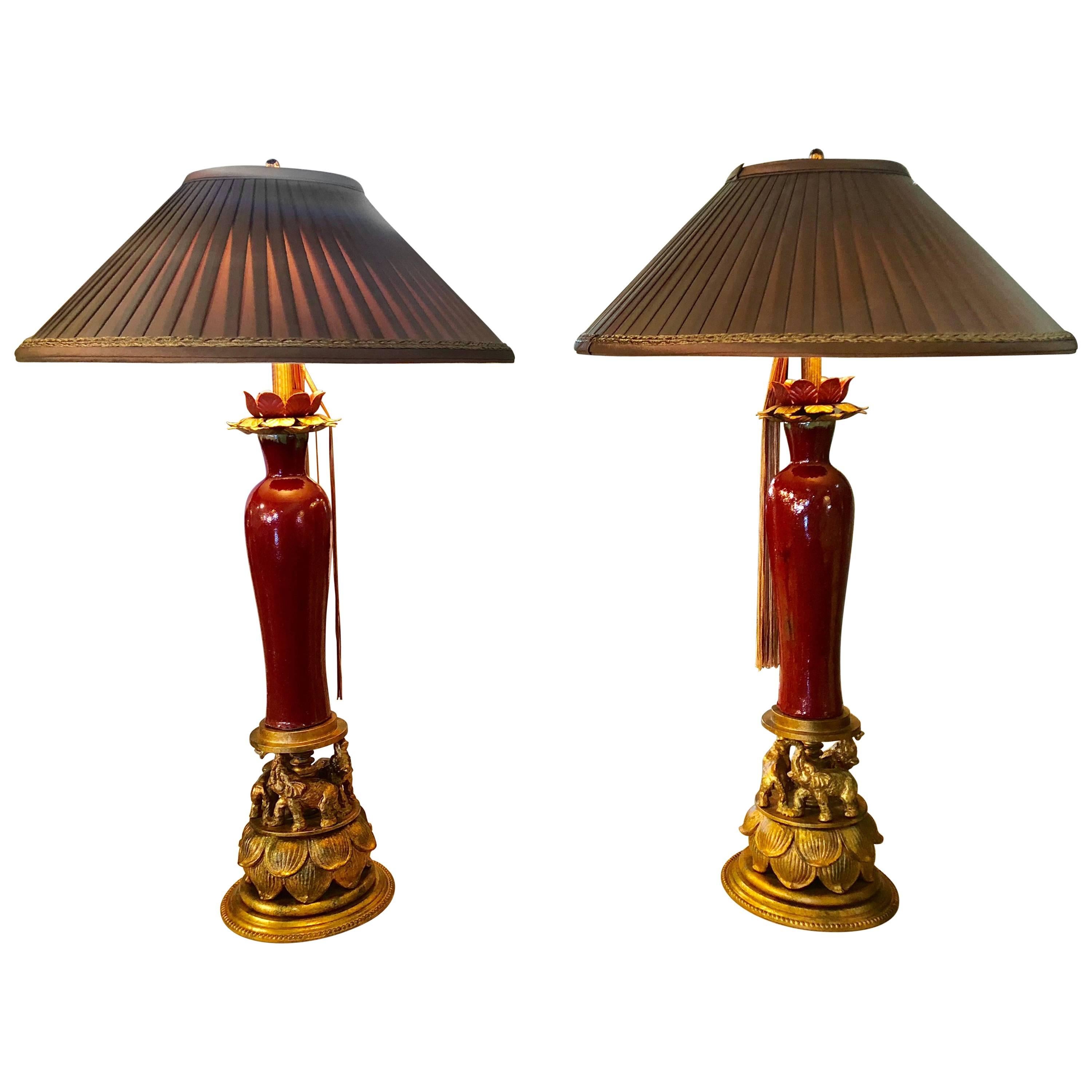 Tole Metal & Red Glaze Table Lamps on Gilt Elephant Bases Signed F. Cooper, Pair