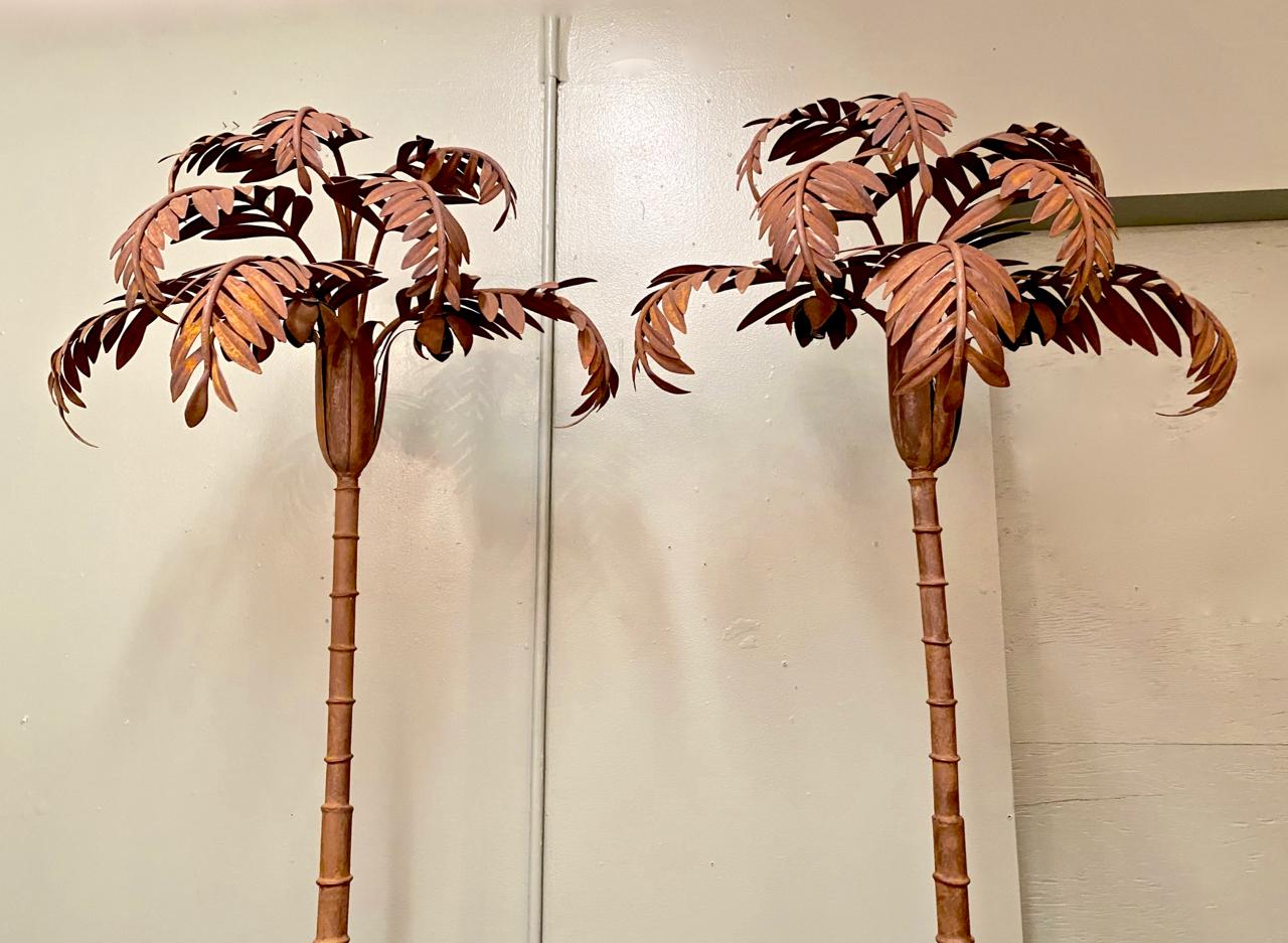 This is a stunning pair of Jansen style/ attributed tole palm trees that have been fitted with three lighting elements. Both of the trees are in overall very good condition and have been rewired. It appears that these trees were never painted, but