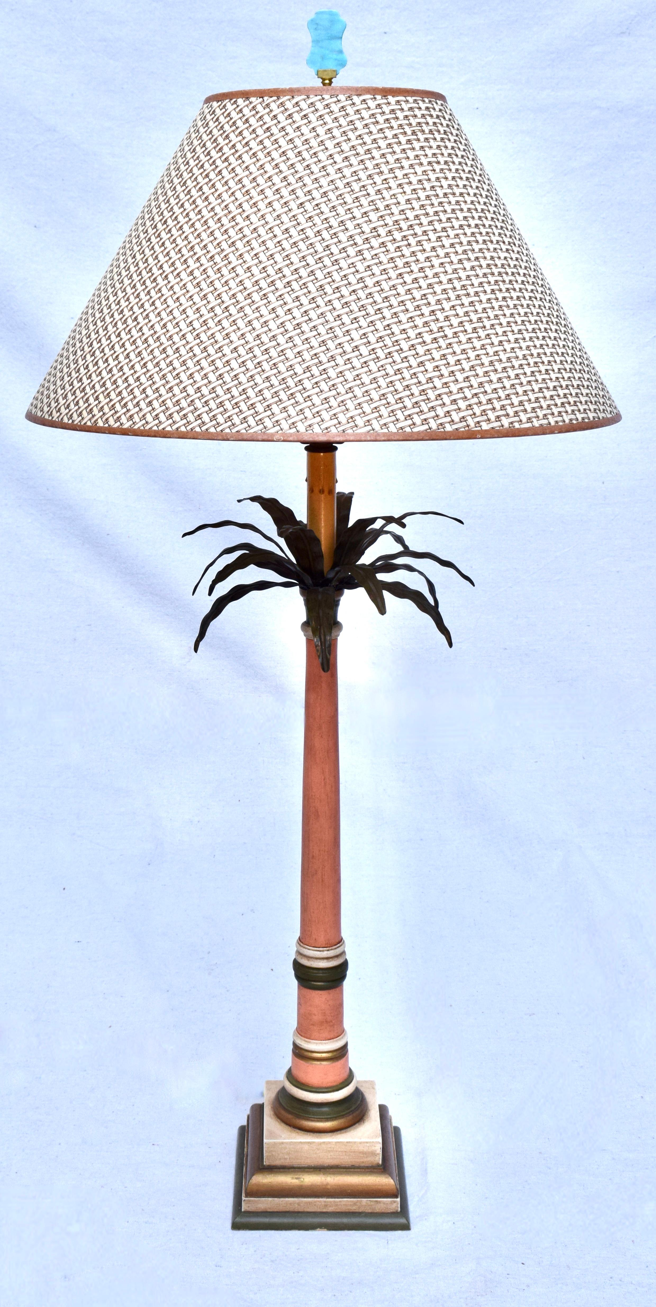 Vintage pair of Palm Tree frond leaf metal tole table lamps painted in Salmon, green & gold adorned with complimenting Cerulean blue marble finials. Custom basketweave rattan cloth shades are included. Three way wiring. Shade dimensions: 18