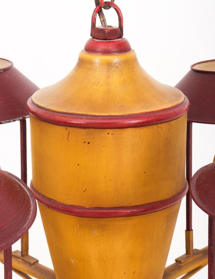 Tole Peinte four-light Lantern in ochre and red, with four lights with cut glass hurricanes and tole peinte shades issuing from a central Urn similarly painted. 

Dimensions: 22