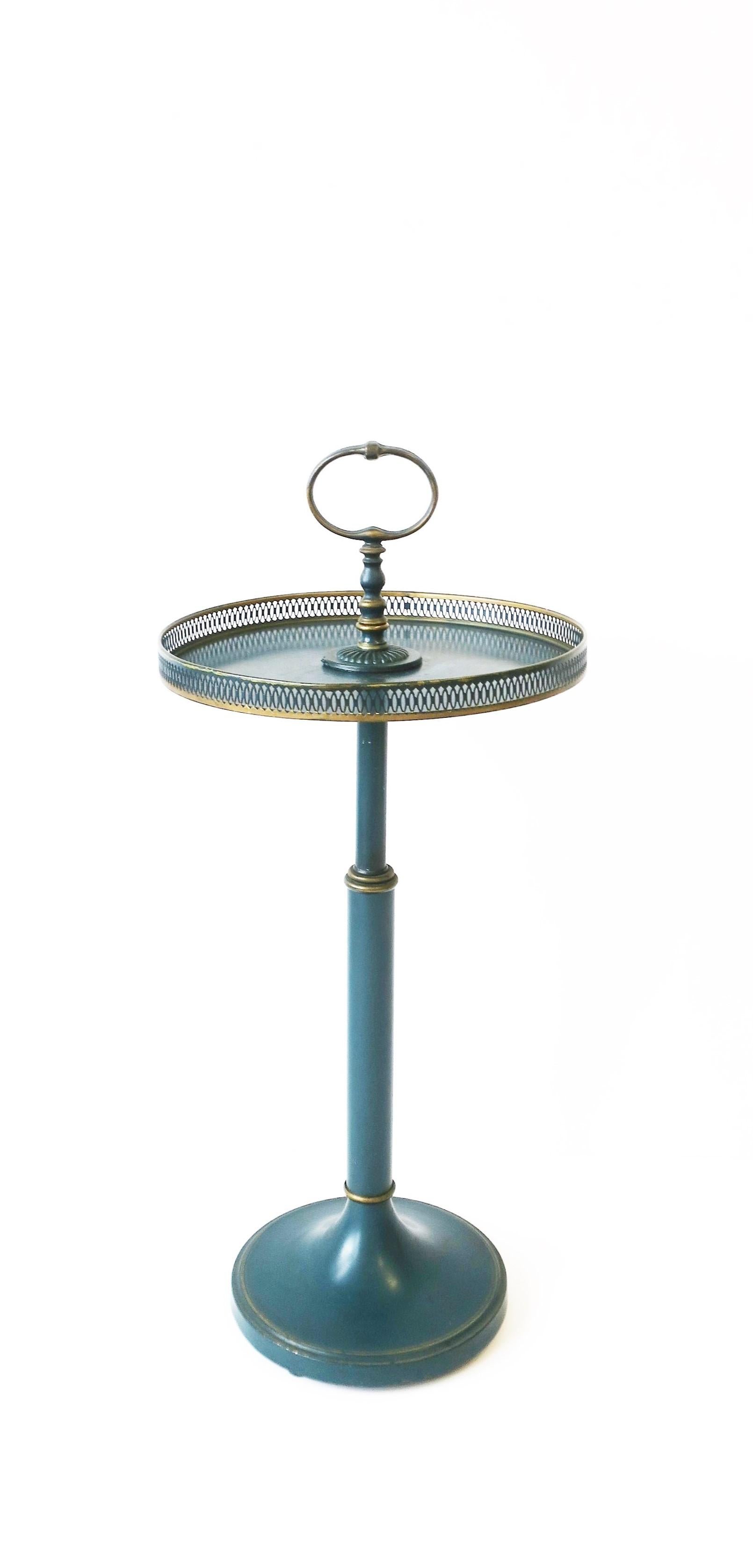 A Tole metal side table with loop handle and gallery edge in blue with gold detail, circa early to mid-20th century. 

Dimensions:
27.5