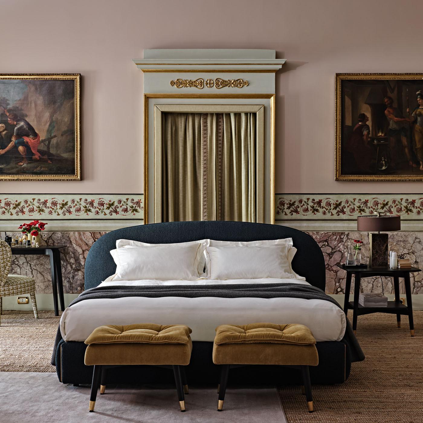 Bed with headboard and bed frame in poplar wood, padding in high-density expanded polyurethane, upholstery in thermo-bonded fibre with stretch jersey. Matt gold wooden details. Wooden slatted base with rigidity adjusters. Mattress size 180x200.