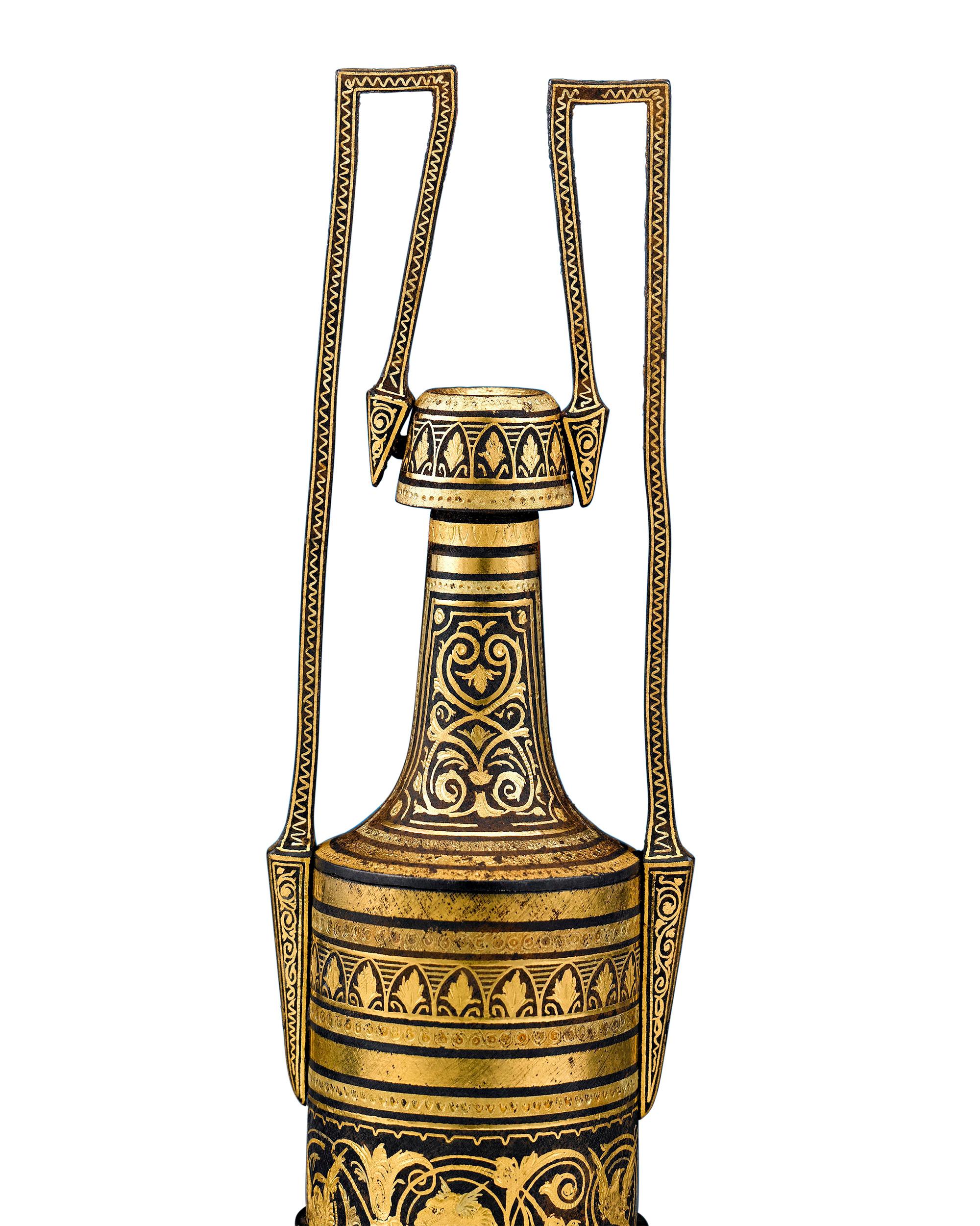 This beautiful damascene urn is a wonderful example of Toledo metalwork. The incredibly fine oxidized steel with gold inlay is congruent with the organic motifs used by craftsmen in the Zamboanga Peninsula of the Philippines. The Spanish first