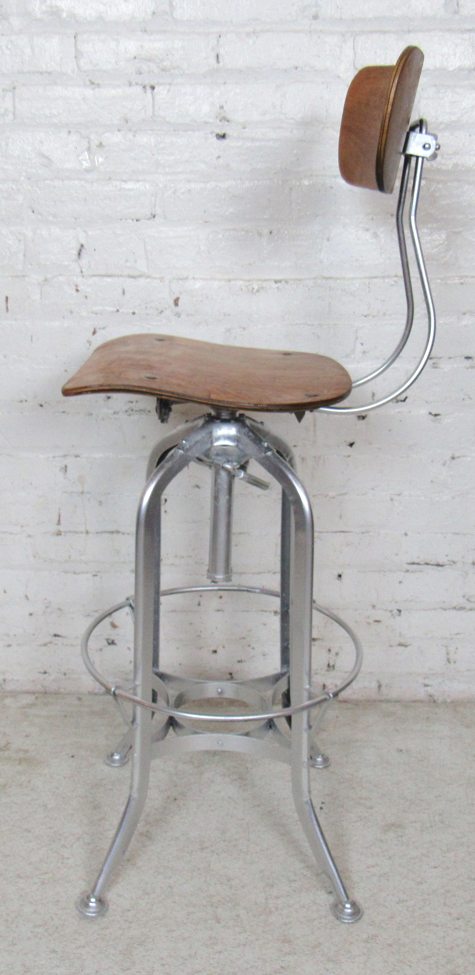 Vintage drafting stool with bentwood seat and back and iron base.
(Please confirm item location - NY or NJ - with dealer).
 