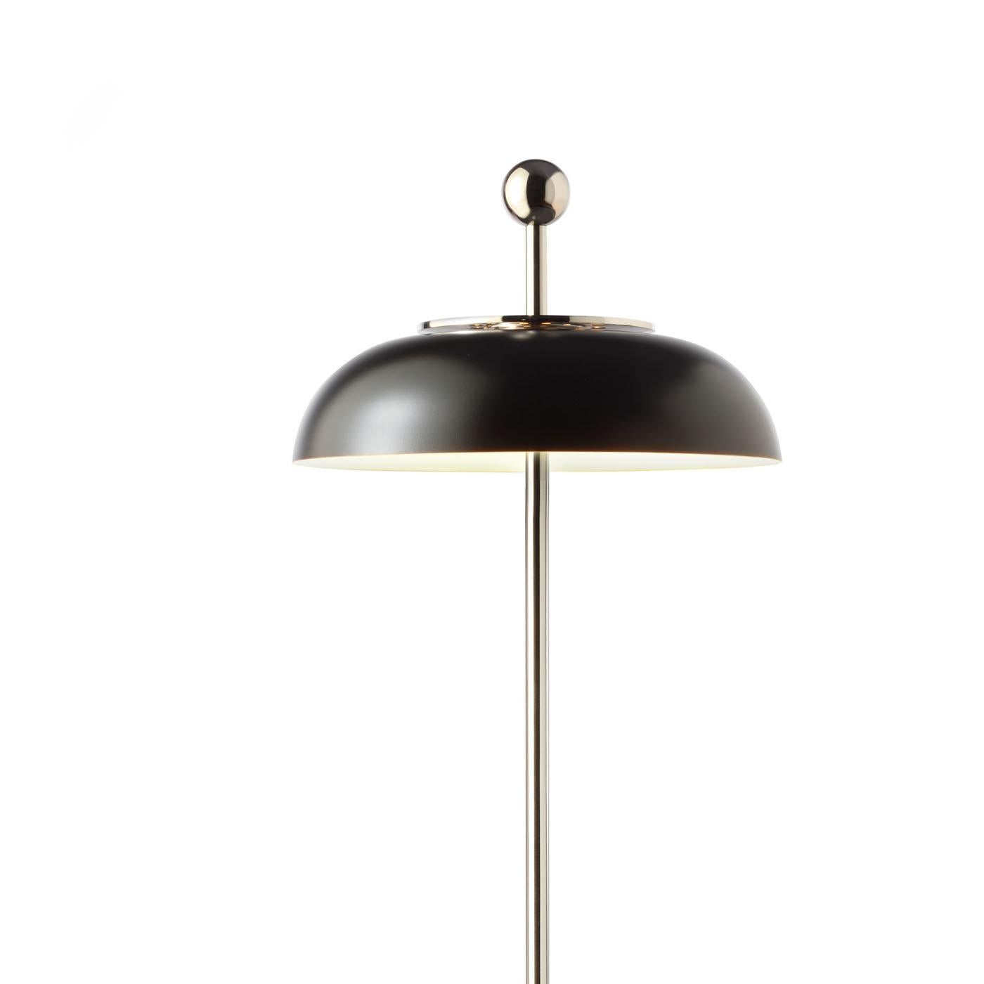 This charming floor lamp is a modern reinterpretation of the classic floor lamp with clean lines, geometric shapes, and cool colors. The use of metal throughout with a nickel finish is also a contemporary choice, while the semi-spherical shade is
