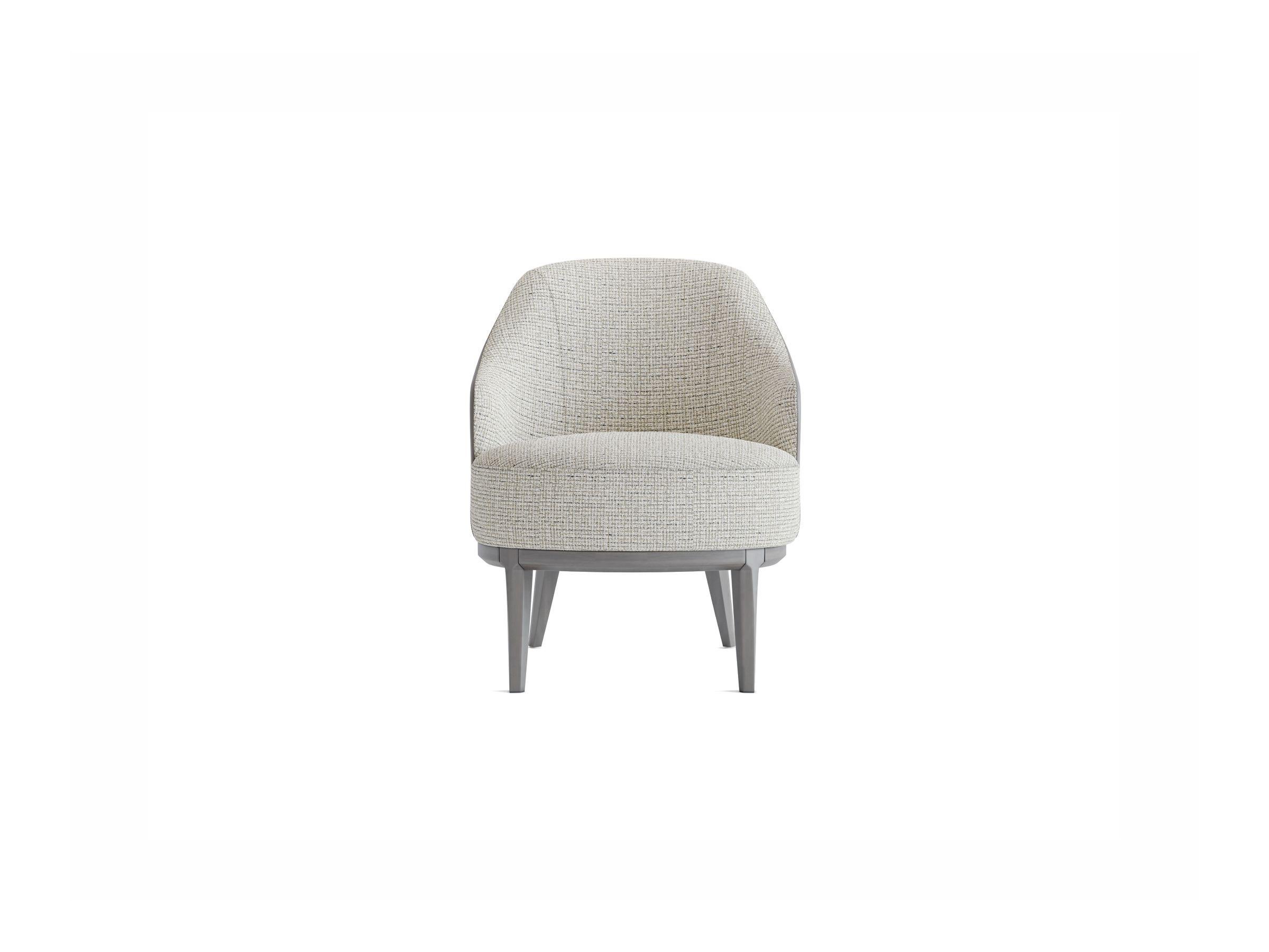 Large, comfortable, and functional. Every detail of its graceful design provides a chic appearance to the TOLINA Armchair. The warm wood tones of this chair, coupled with a classic fabric design, creates a perfect harmony with the rest of your