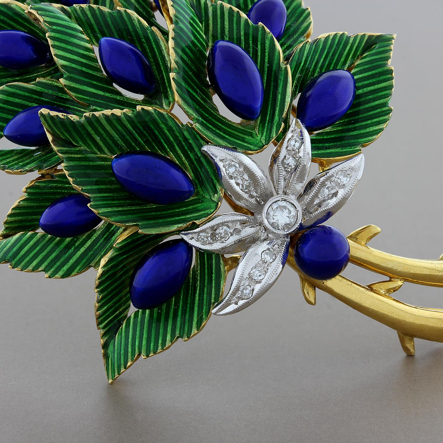 An admirable brooch by Italian designer Toliro. Each leaf of the 18K yellow gold bouquet is hand painted with vibrant green and blue enamel. Tying the bouquet together is a flower of made of 18K white gold with 0.17 carats of VS quality diamonds. 