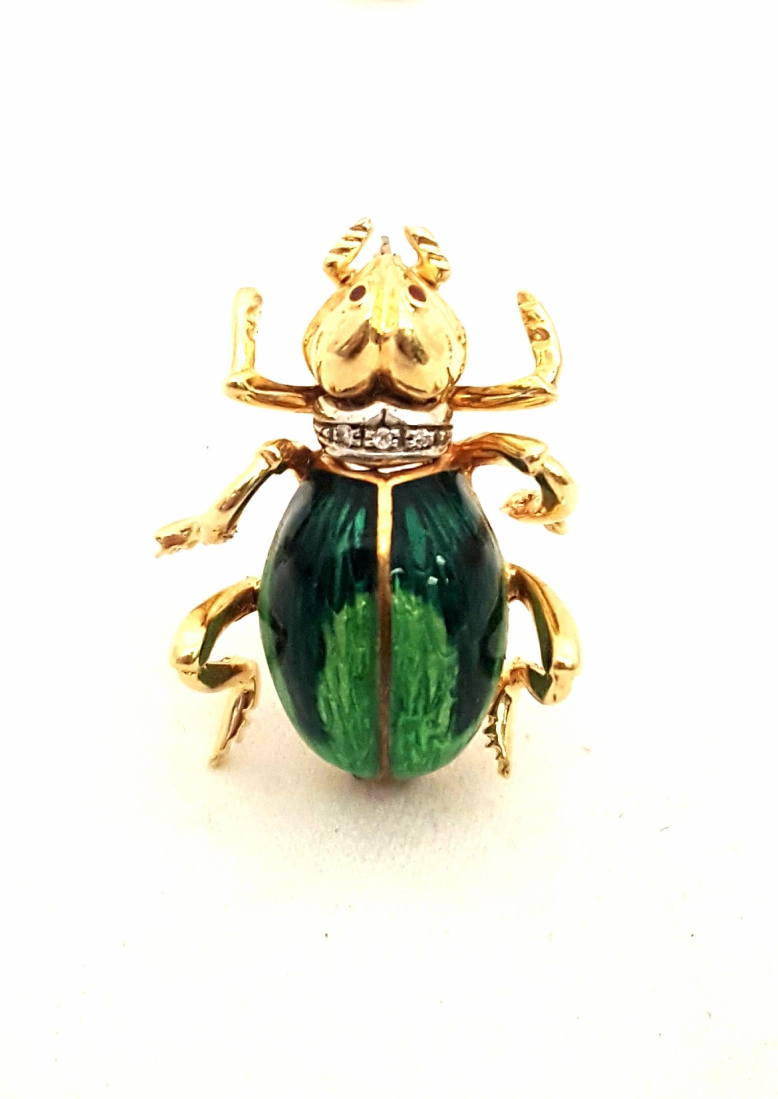 What's all the buzz?  It's compliments on this extraordinary bee brooch meticulously crafted in 18 karat yellow gold.  Detail is lifelike!  An ombre green enamel body and cabochon ruby eyes add interest and color.  Bee is wearing a little diamond