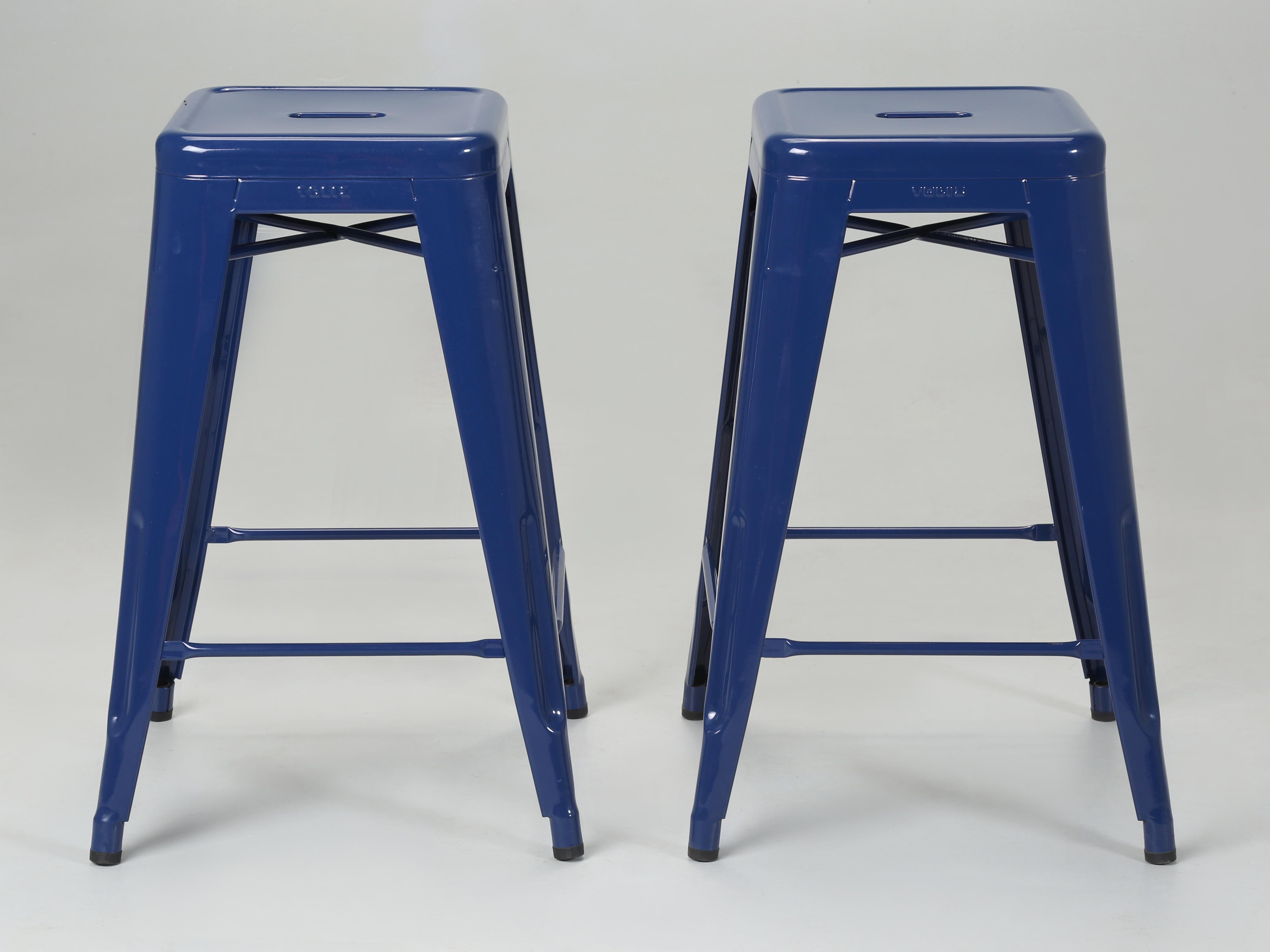 Genuine Made in France Tolix Kitchen Counter Stools in a Powder-coated Navy Blue finish. These are the last two Counter Stools that we have left in Navy Blue. Other colors and sets are available. Currently, we have approximately 700-pieces of