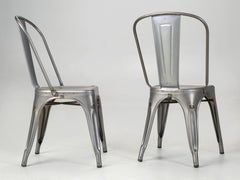 Tolix Pareja de sillones de acero sin pintar Fabricados en Francia