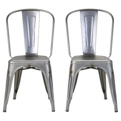 Tolix Coppia di poltrone in acciaio non verniciato Made in France