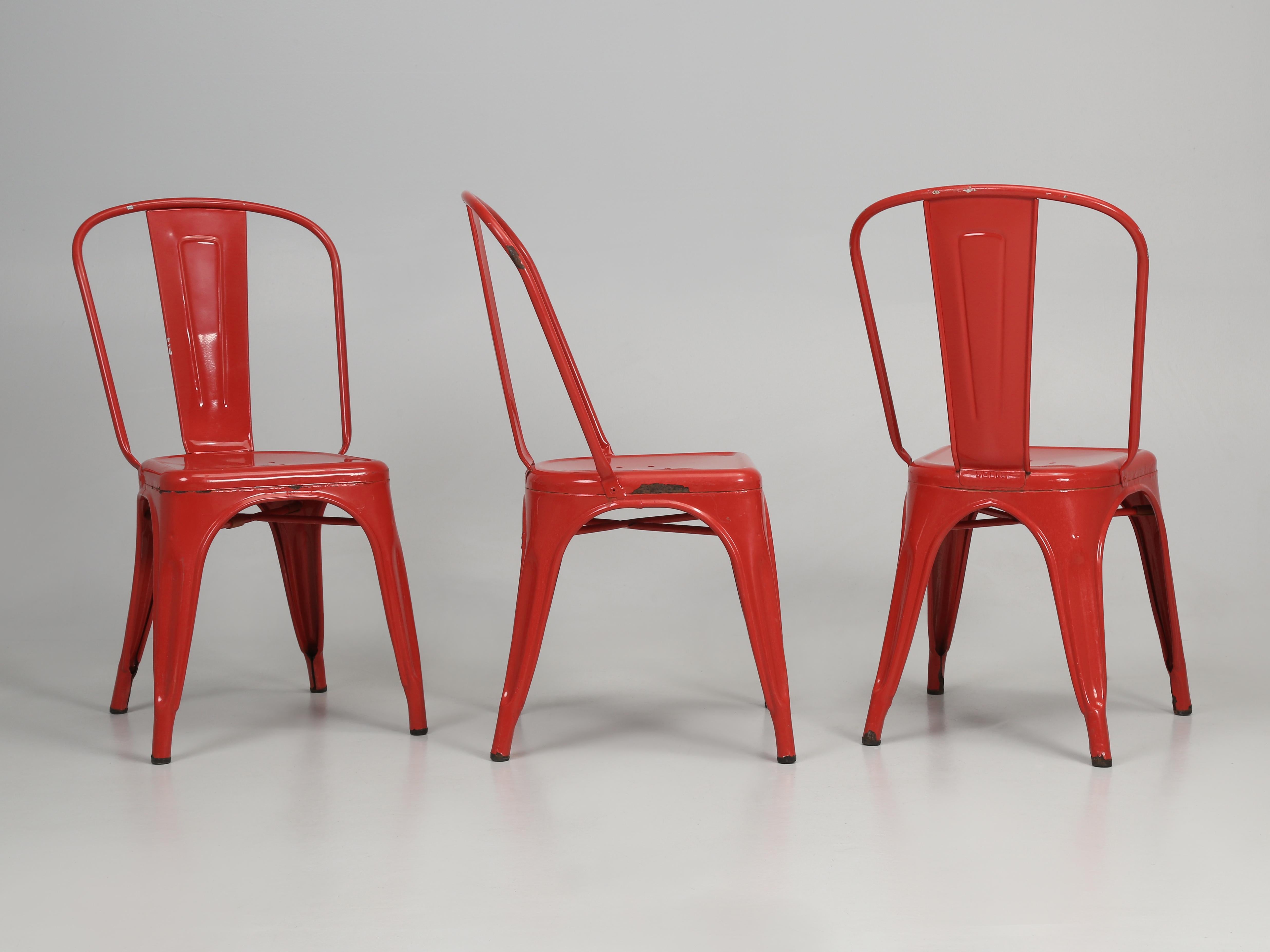 French Set of (4) Authentic Vintage Tolix steel chairs.  Tolix Steel Stacking Chairs have been hand-made for about 100-years in France, while this Set of (4) Red Tolix Chairs looks to be made in the 1950's or 1960's. Should you prefer a different