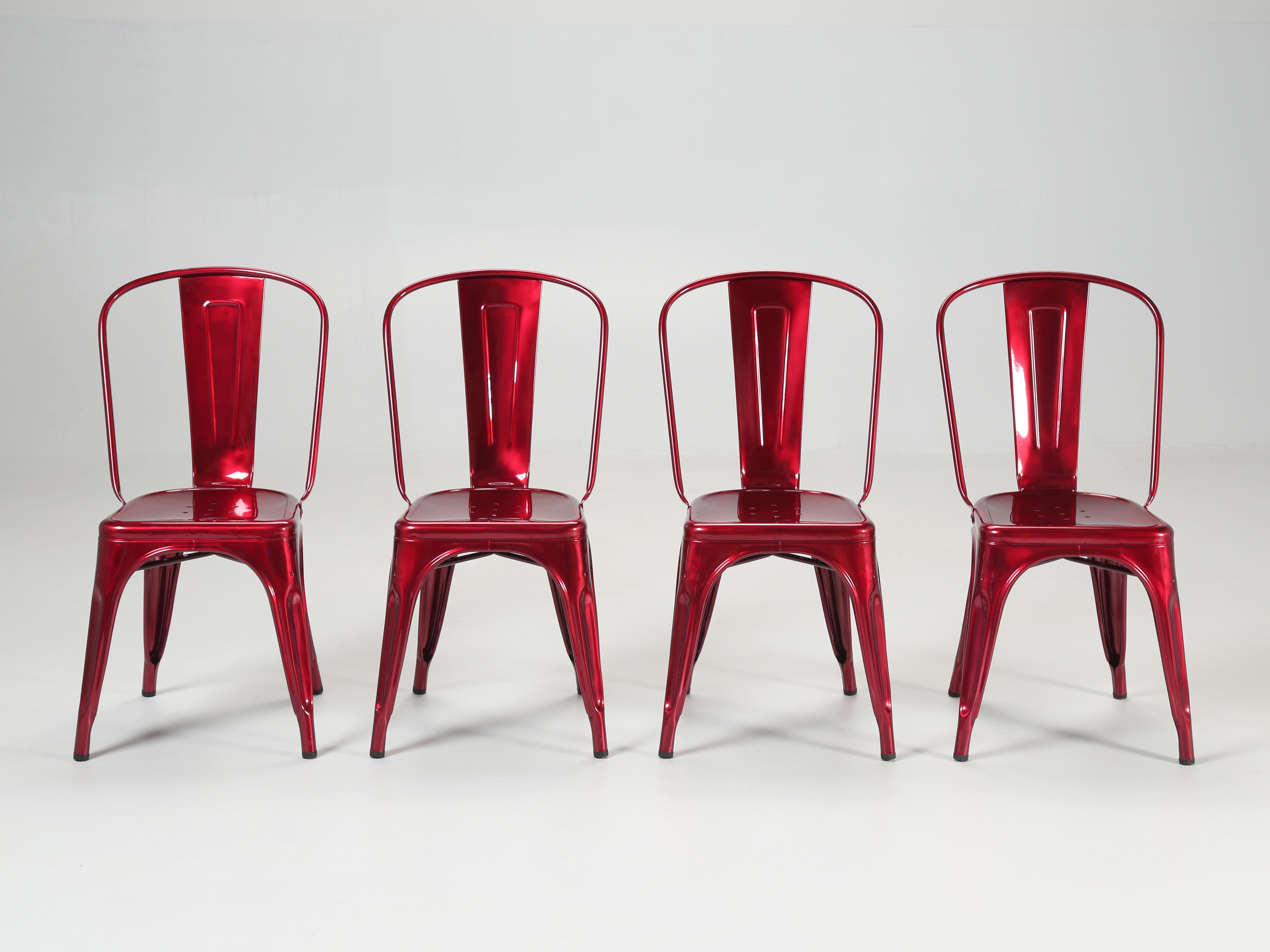 Tolix steel stacking chairs in an incredible vibrant raspberry metallic. In the automotive world, one would call this 