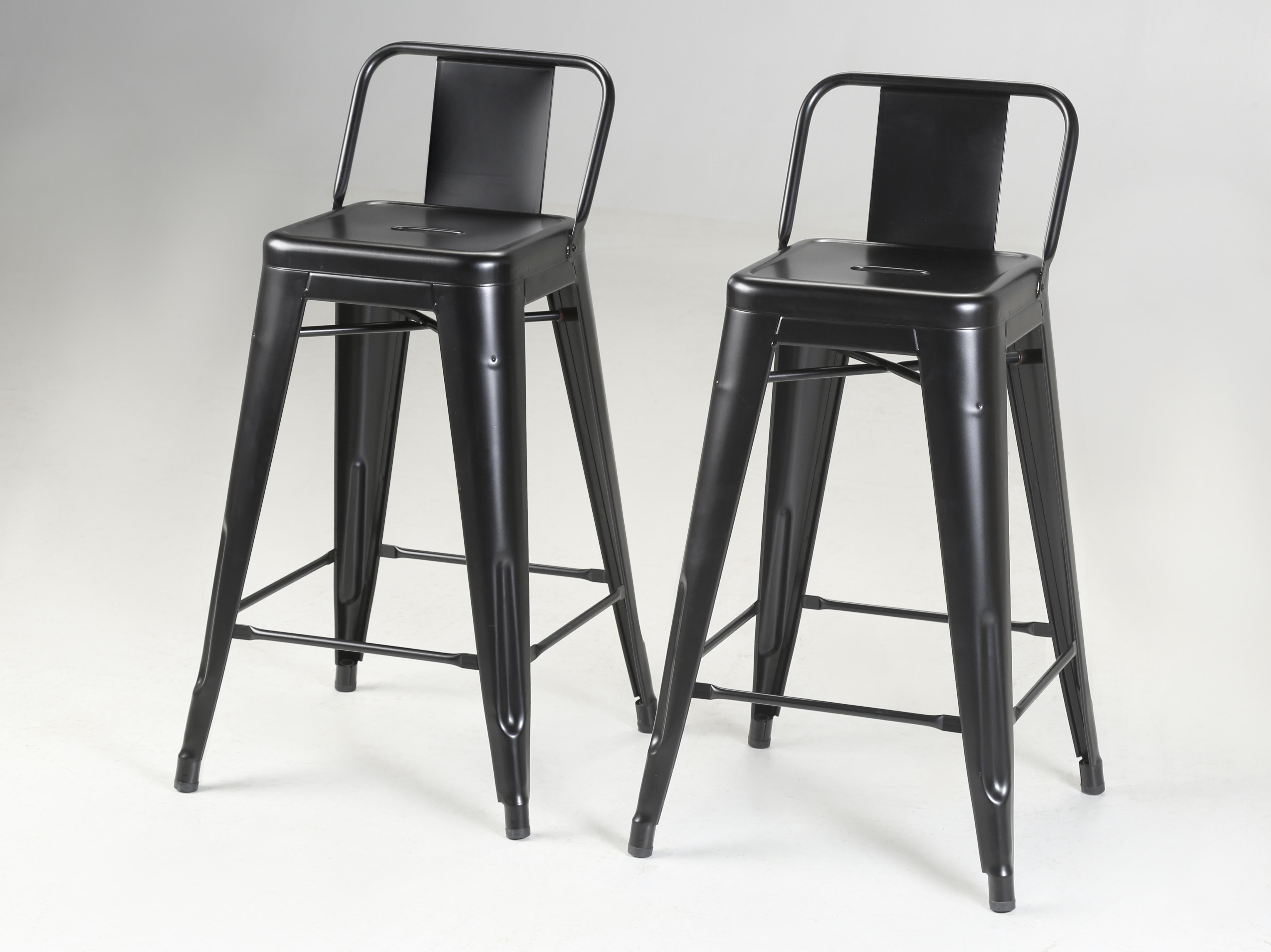 Tolix Steel Counter-Height Stools in a Powder-Coated Jet Matte Black finish that recently emerged from a 10-year storage facility. We currently have over 900-pieces of Genuine French Made Steel Tolix Stools in three-heights, Tolix Chairs and Tolix
