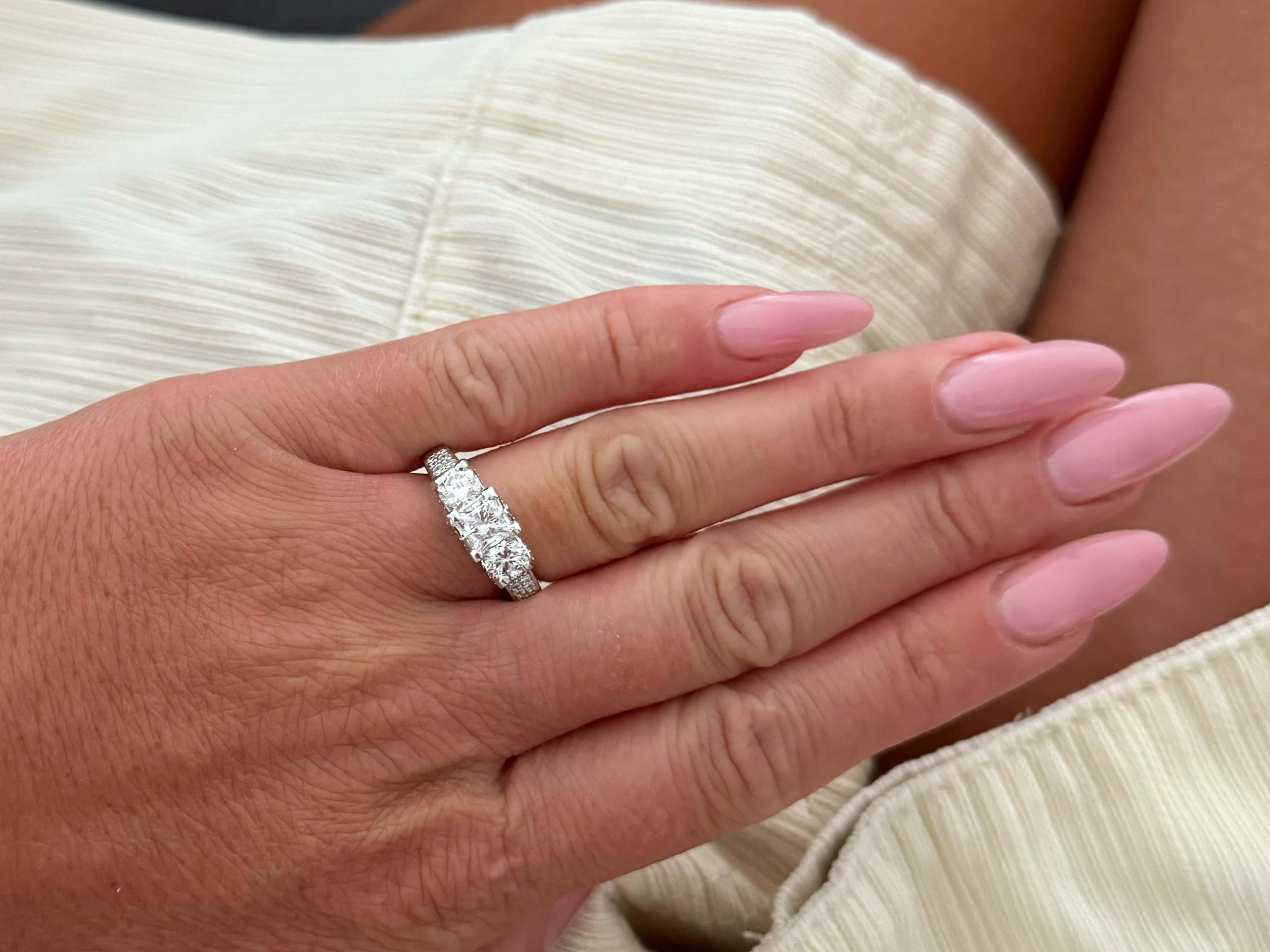 Item Specifications:

GSI REPORT #: 4434600103

Metal: 14k White Gold 

Center Diamond Carat Weight: 0.96 carats
Center Diamond Cut Grade: Ideal
​
​Center Diamond Color: H

Center Diamond Clarity: I1
​
​2 Brilliant Cut Side Diamonds: each one is